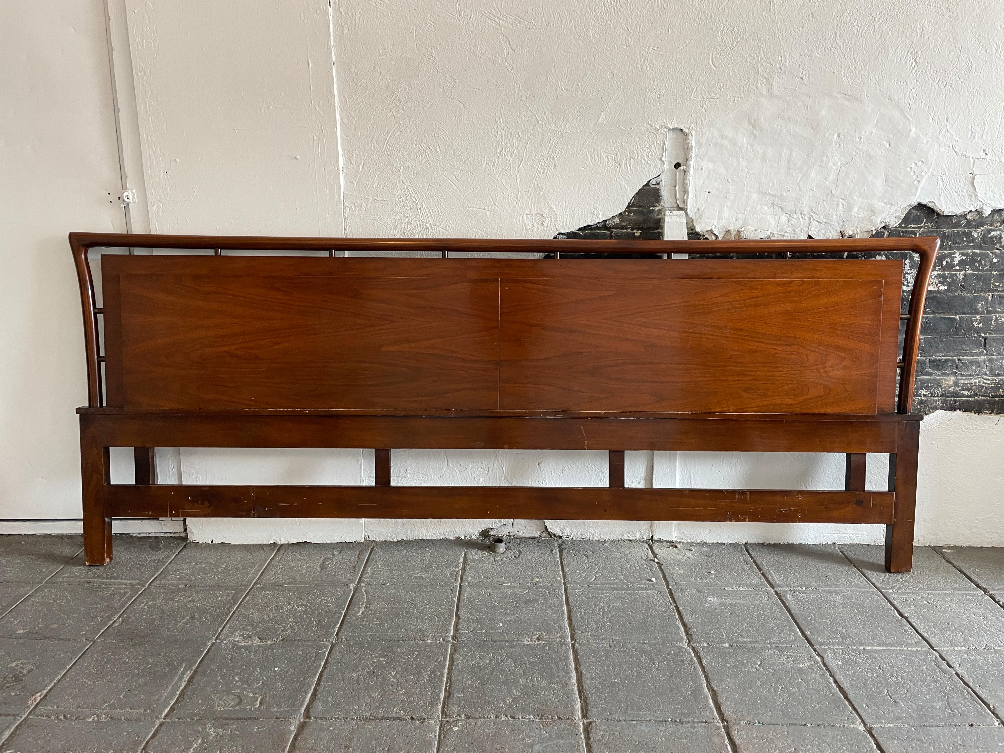 Beautiful American mid century King bed headboard in excellent vintage condition with sculpted wood details with brass accents. finely crafted. Fits a King sized mattress. Bed Headboard only NO metal bed Frame. Easily mounts to all bed frames.