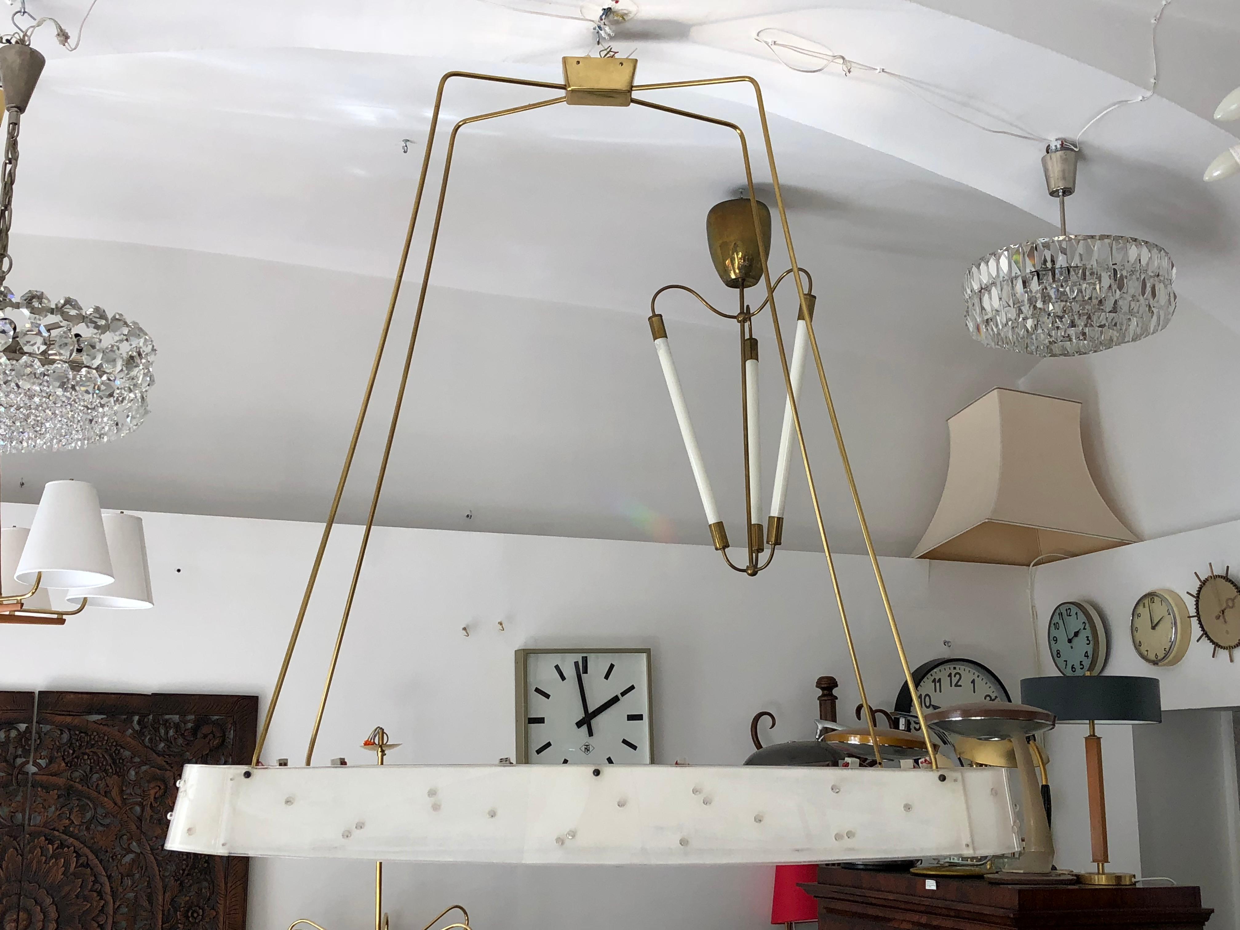 Brass frame with huge plexiglass shades, fitted with eight E27 sockets, made in Austria, Vienna by unknown chandelier maker in the late 1950s.