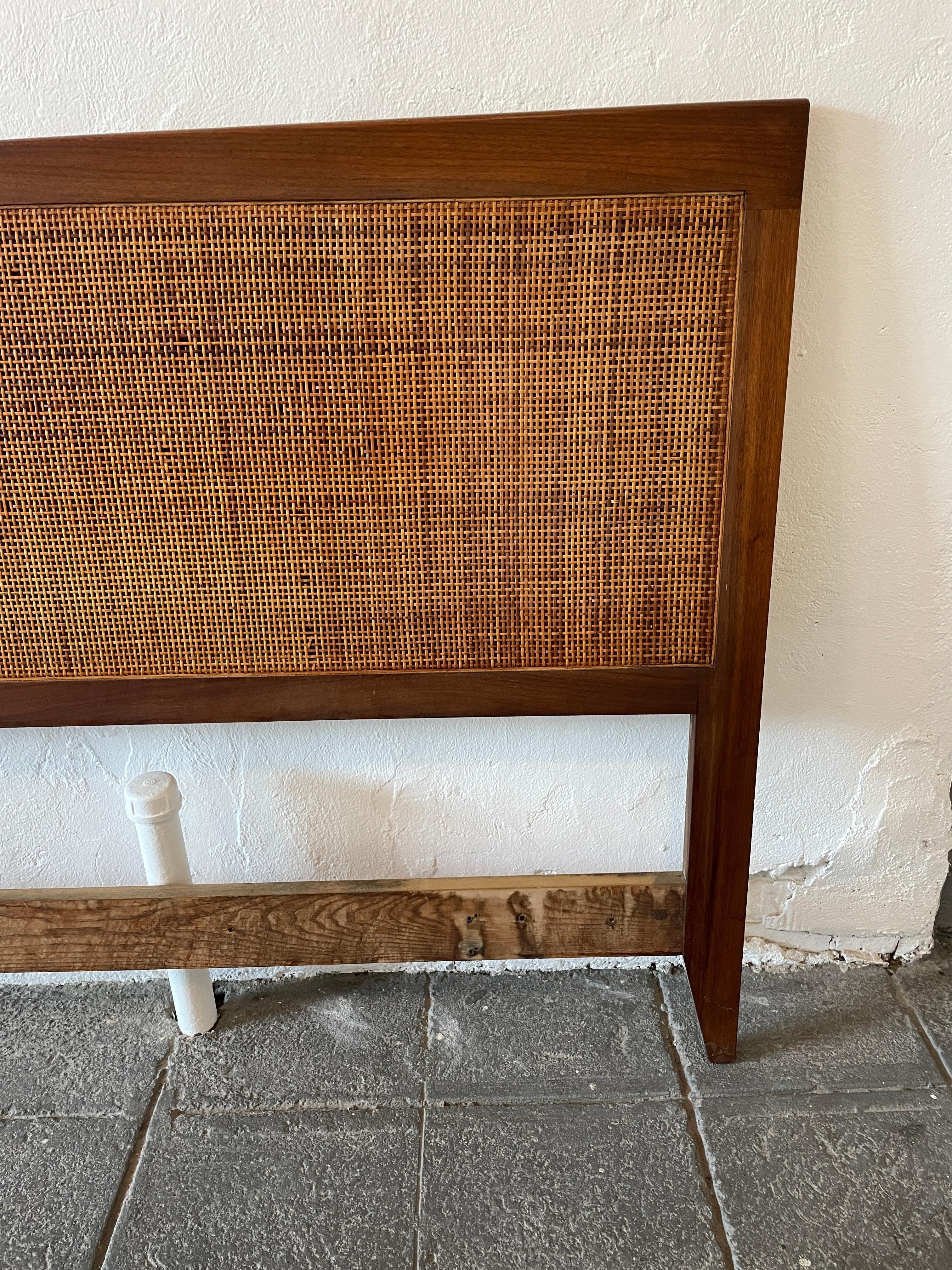 Beautiful American mid Century King bed headboard in wonderful vintage condition with a few breaks to the cane it has a wonderful patina. finely crafted solid walnut wood. Fits a King sized mattress. Bed headboard only no metal bed Frame. Easily