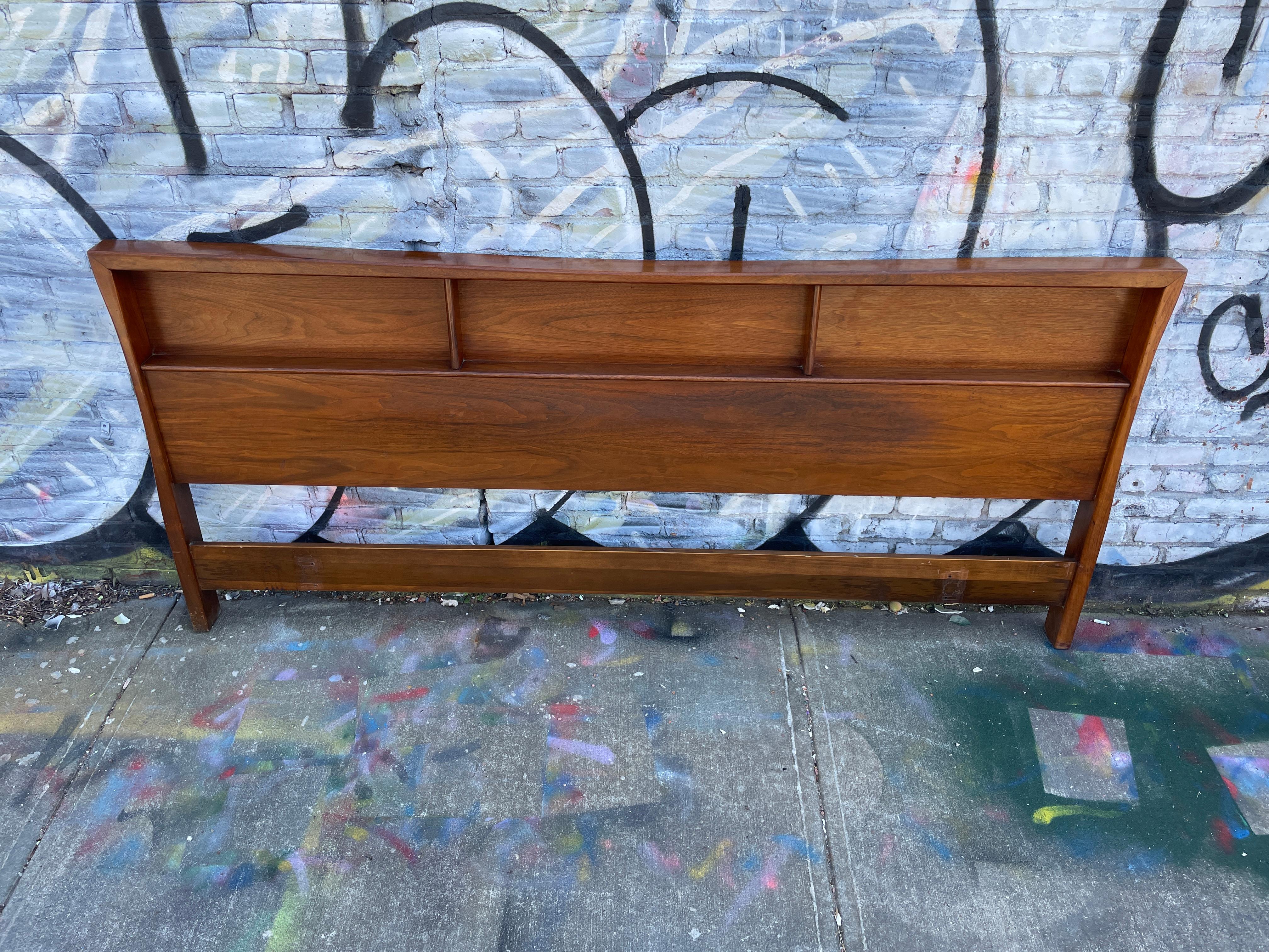 Beautiful American mid Century King bed headboard in excellent vintage condition with 3 narrow shelves - its perfect. finely crafted. Fits a King sized mattress. Bed Headboard only NO metal bed Frame. Easily mounts to all bed frames. Numbered on