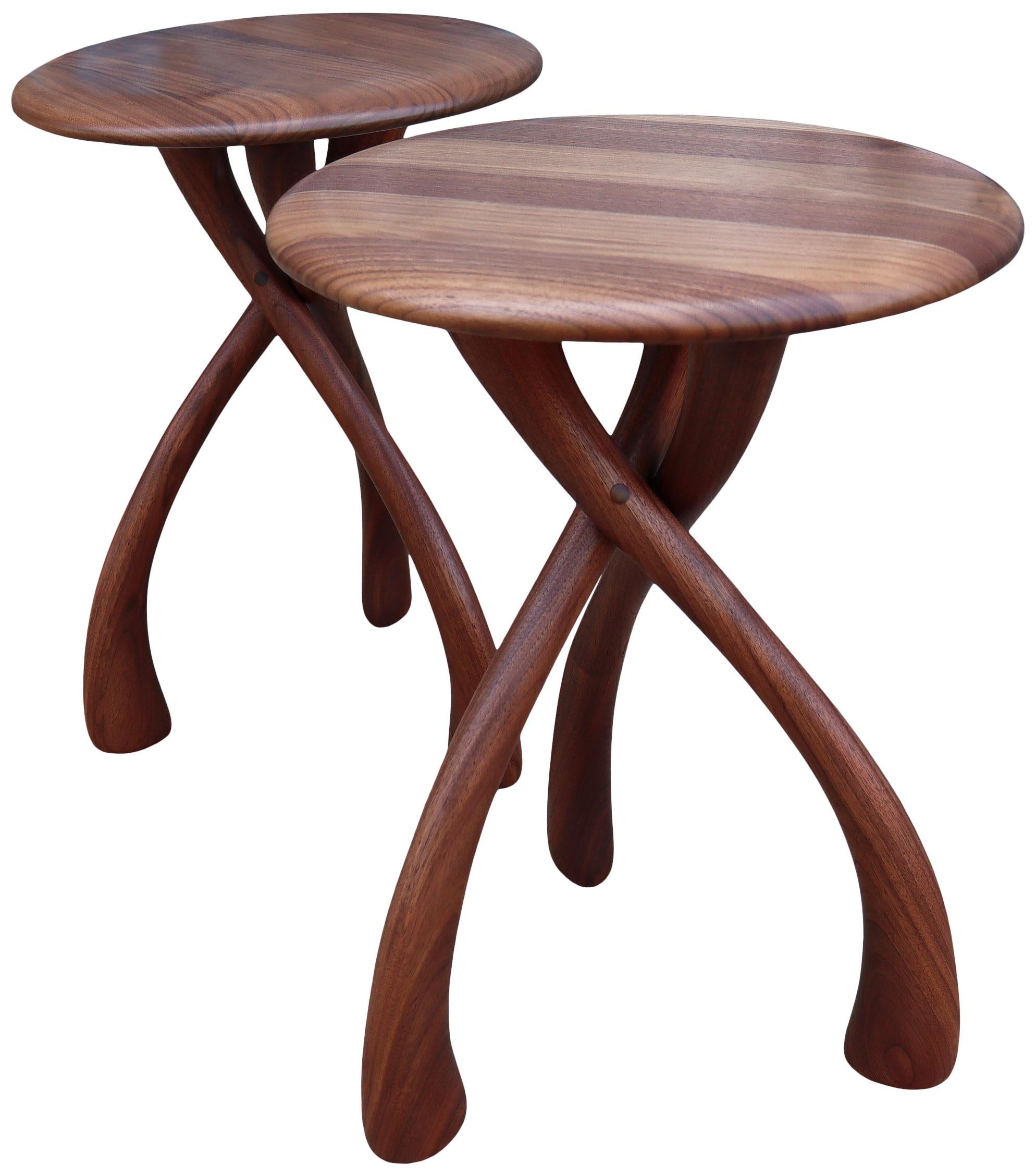Beautiful wishbone round top tables designed by Dean Santner in black walnut.

Wonderful proportions make great use as a side table, end table, bedside tables or nightstands. A sensuous rounded waterfall edge with graceful carved lines. A