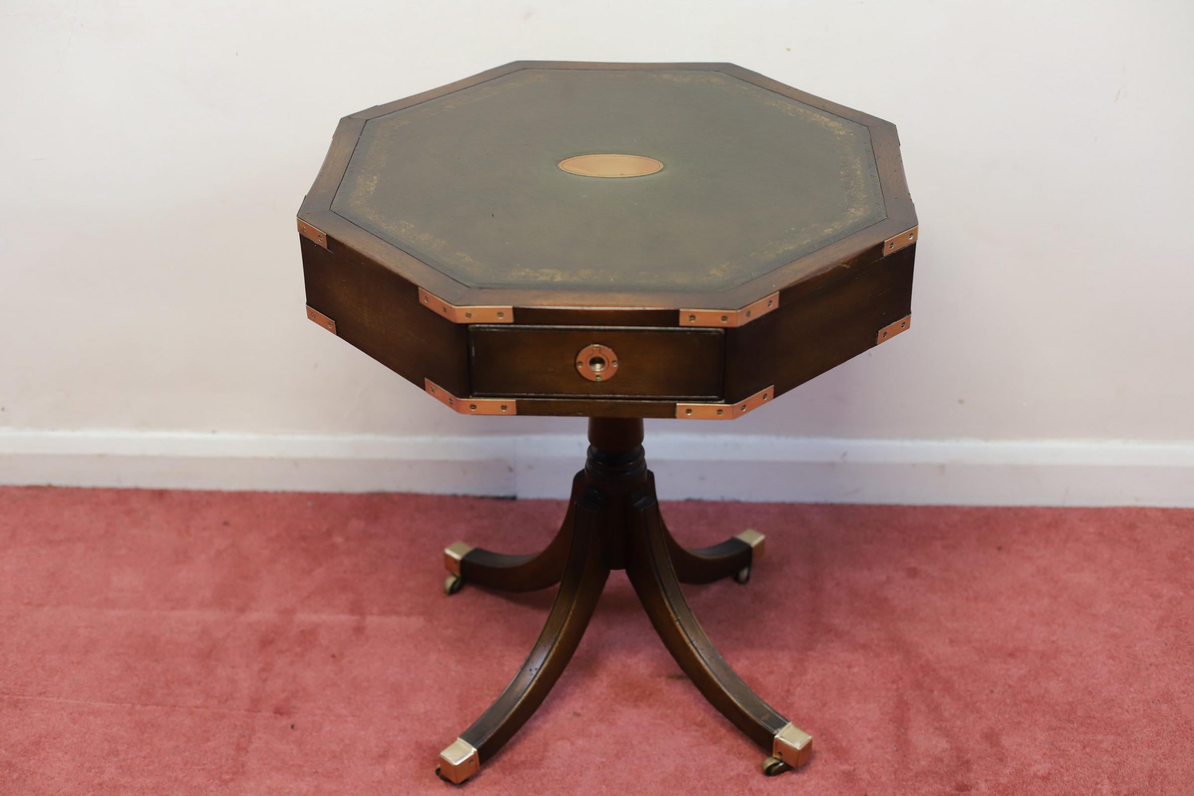 
We delight to offer for sale this lovely Campaign style drum table made by Bevan Funnell , with insert leather top , the handles are all original and the top is on a revolving base , in good condition .
Don't hesitate to contact me if you have any