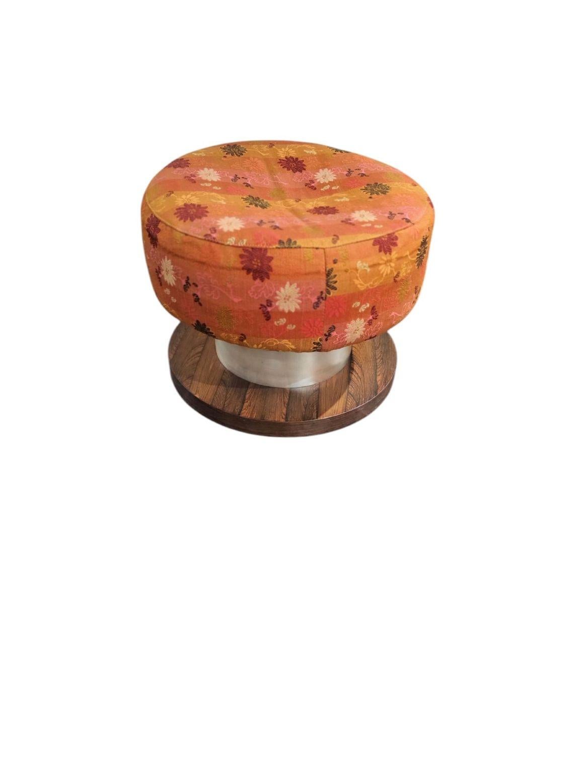 Milo Baughman Rosewood and aluminum stool circa 1960-70’s. In original condition with a floral print on the seat. Would recommend reupholstery. Dimensions 16 inches in diameter by 13 inches high.