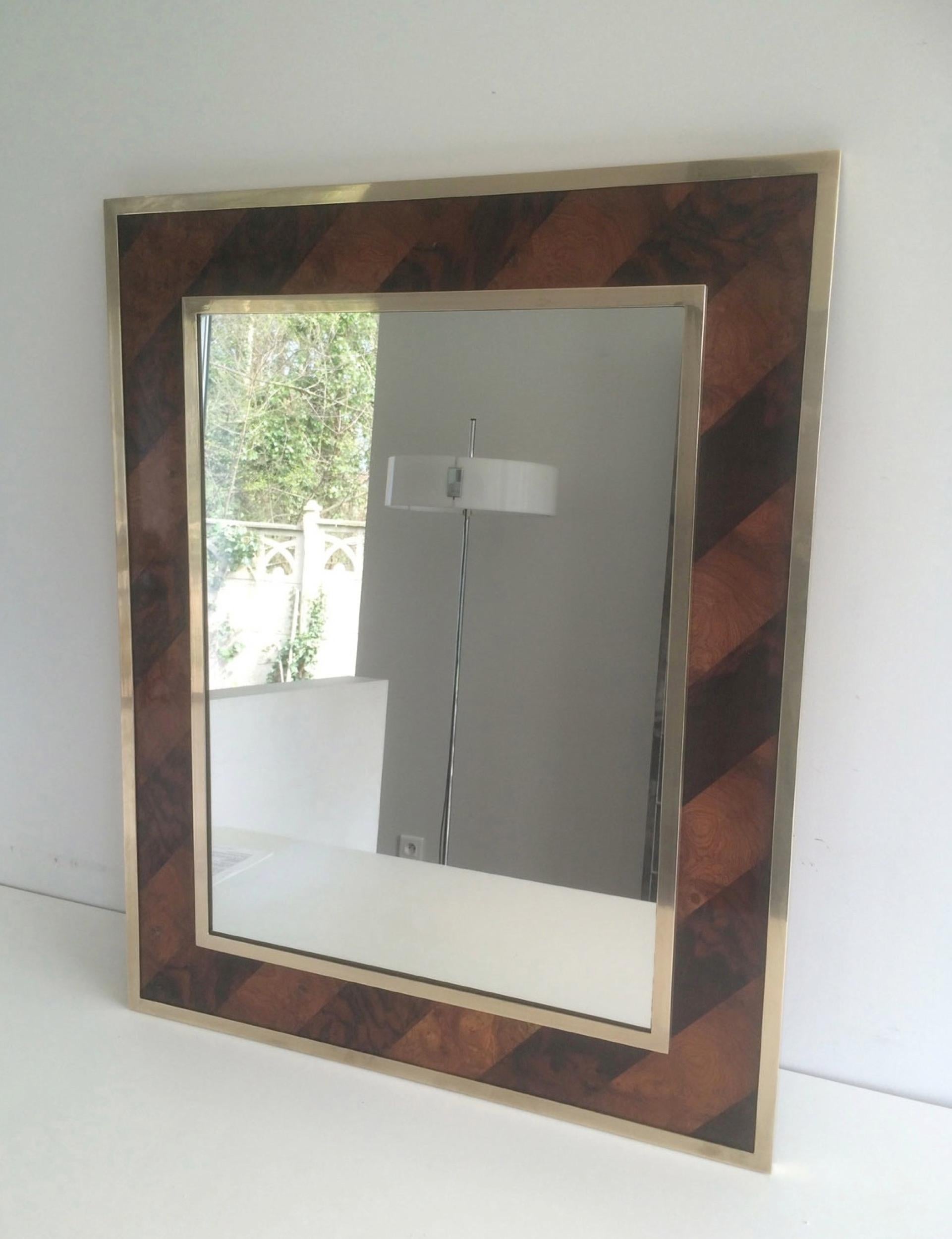 This beautiful mirror is made of a burr walnut marquetry surrounded by two brass frames. This is French work, circa 1960.