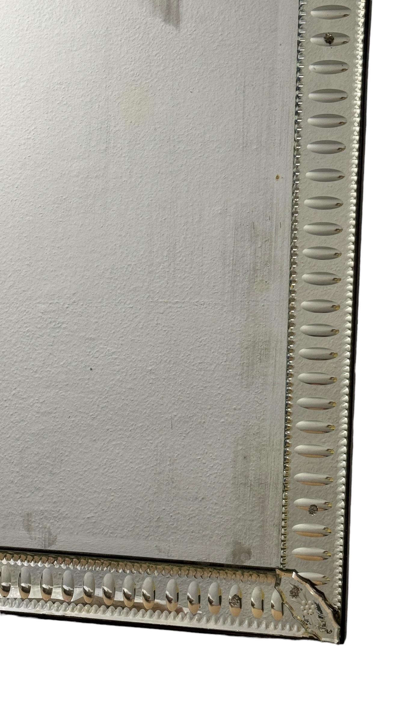 A stunning Murano glass mirror hand cut glass parts with engravings. It is approx. from the 1940s or older. With signs of wear as expected with age and use, also some distressed spots like seen in pictures. Obviously this item is not new, so please