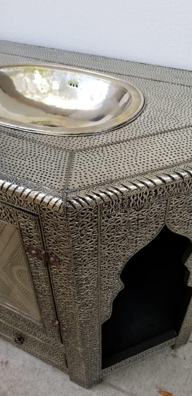 Silver sink vanity made in Morocco ,silver tone hand tooled silver metal.One has arches and one doesn't some price.