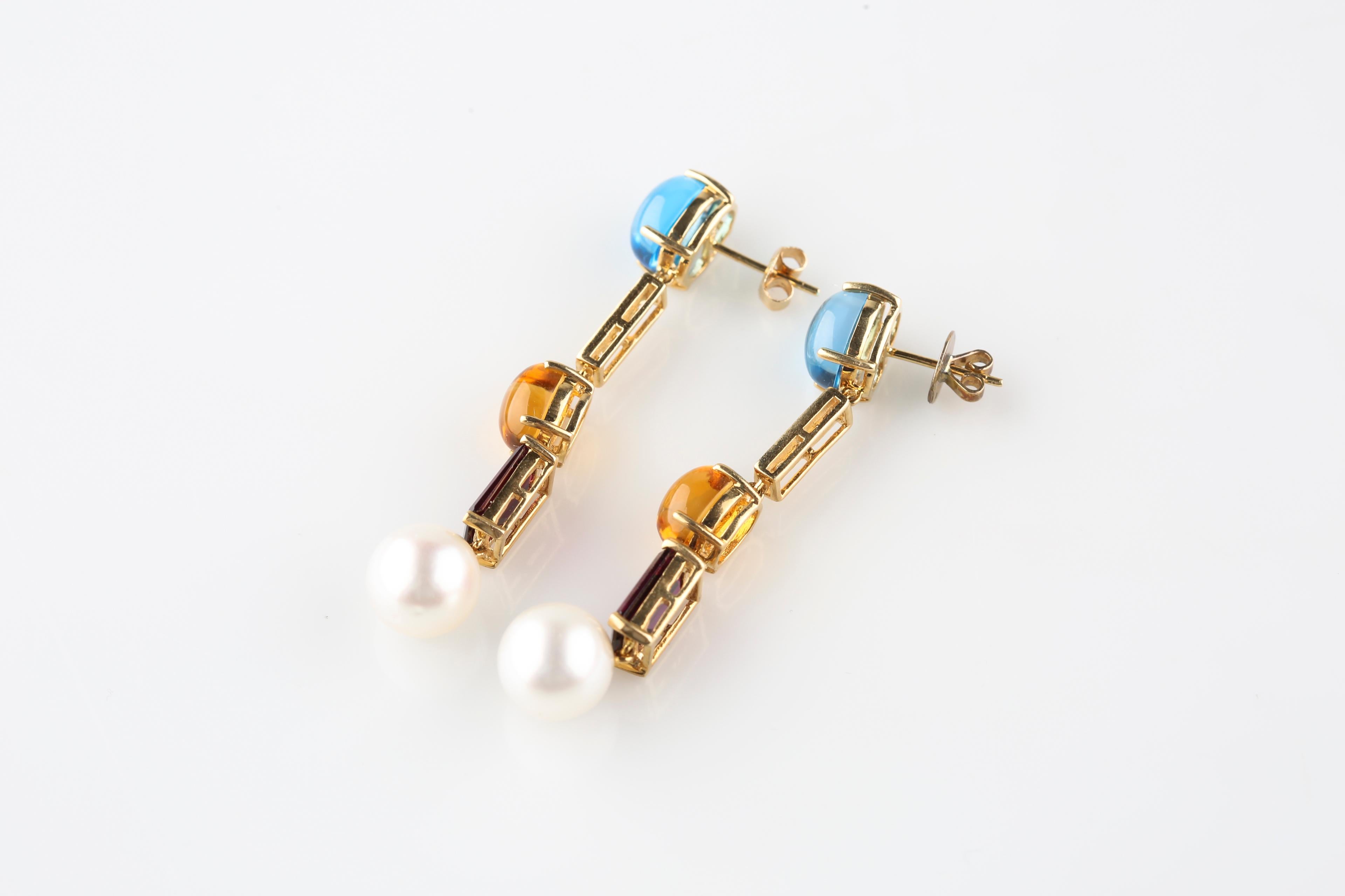 Gorgeous, Unique Multi-Color Gemstone, Diamond, and Pearl Drop Earrings
Each Earring Includes:
Prong Set Blue Topaz Cabochon (Appx 7 mm Wide x 9 mm Long)
Three 0.10 Ct Round Diamonds in Pave Plaque Settings (TDW for both earrings = 0.60 ct)
Prong