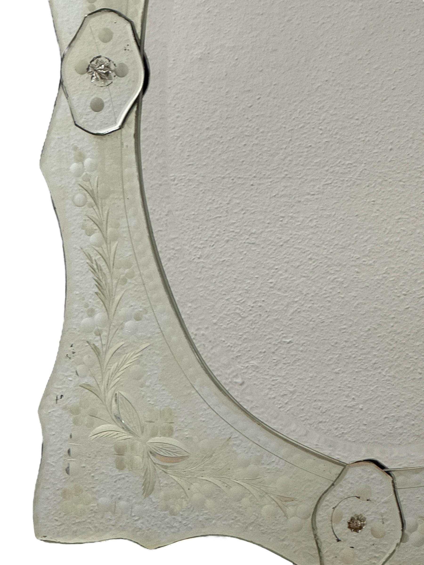 A stunning Murano glass mirror hand cut glass parts with engravings. It is approx. from the 1950s. With signs of wear as expected with age and use, also some distressed spots like seen in pictures. Obviously this item is not new, so please check all
