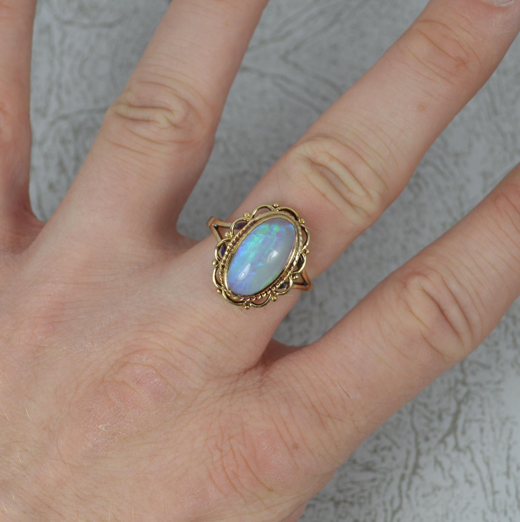 A beautiful ladies opal ring. Solid 9 carat yellow ring. Opal to the centre measures 8mm x 14.5mm and is full of deep blue, green and red colours.

Condition ; Excellent. Clean ring. Strong, round band. Securely set stone.

Please view photographs