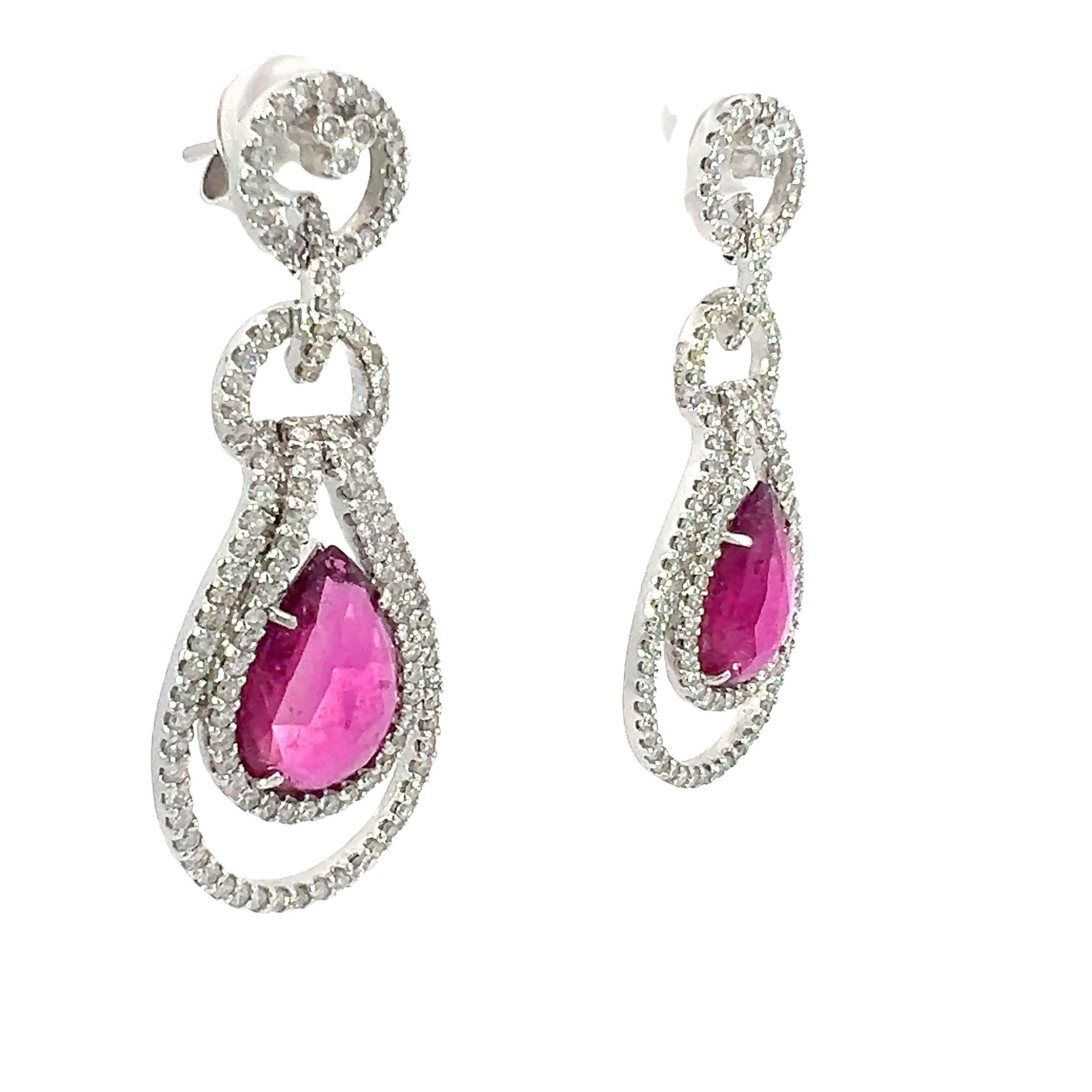 An amazing set of earrings designed in 18kt white gold, with a natural 8.95-carat tourmaline and 3.10-carat diamond. 

The brilliant color of the gemstones and the brilliance of sparkling accents are combined in this magnificent pair of pink