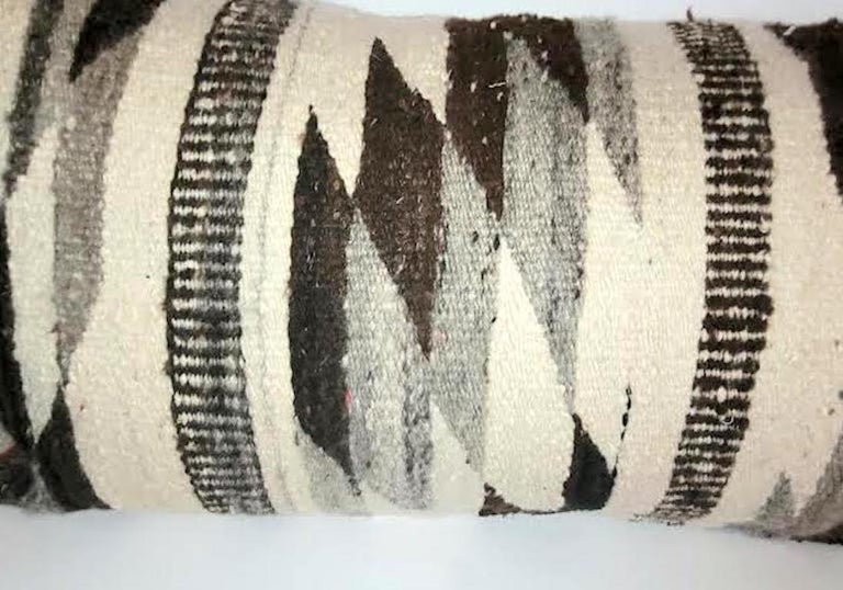 Beautiful Navajo Eye Dazzler geometric bolster pillow. This pillow has a nice texture backing and has a zippered casing. Feather and Down Insert.