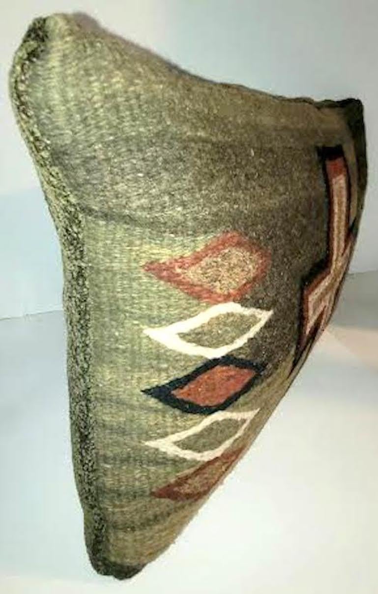 Fantastic Navajo weaving pillow with cross. Beautiful colors Olive green, forest green, off white, rust, browns, and black. The backing a a textured green velvet. Zippered casing. Feather and down insert.