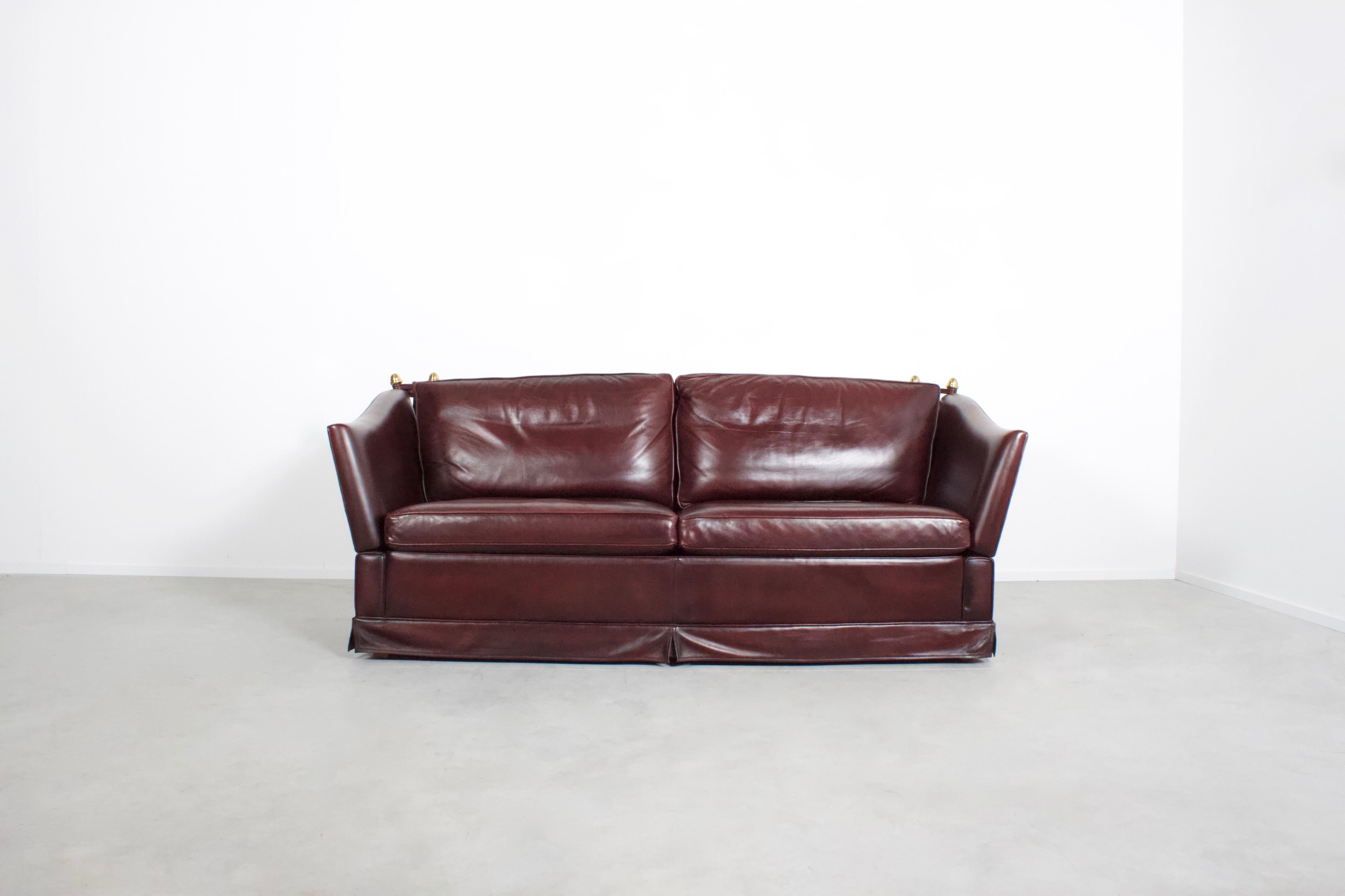 Neoclassical sofa in excellent condition

Manufactured by Maison Jansen, France 1970s

The sofa is upholstered in a beautiful thick burgundy natural leather which is in excellent condition.

The back and the armrests are held together by a