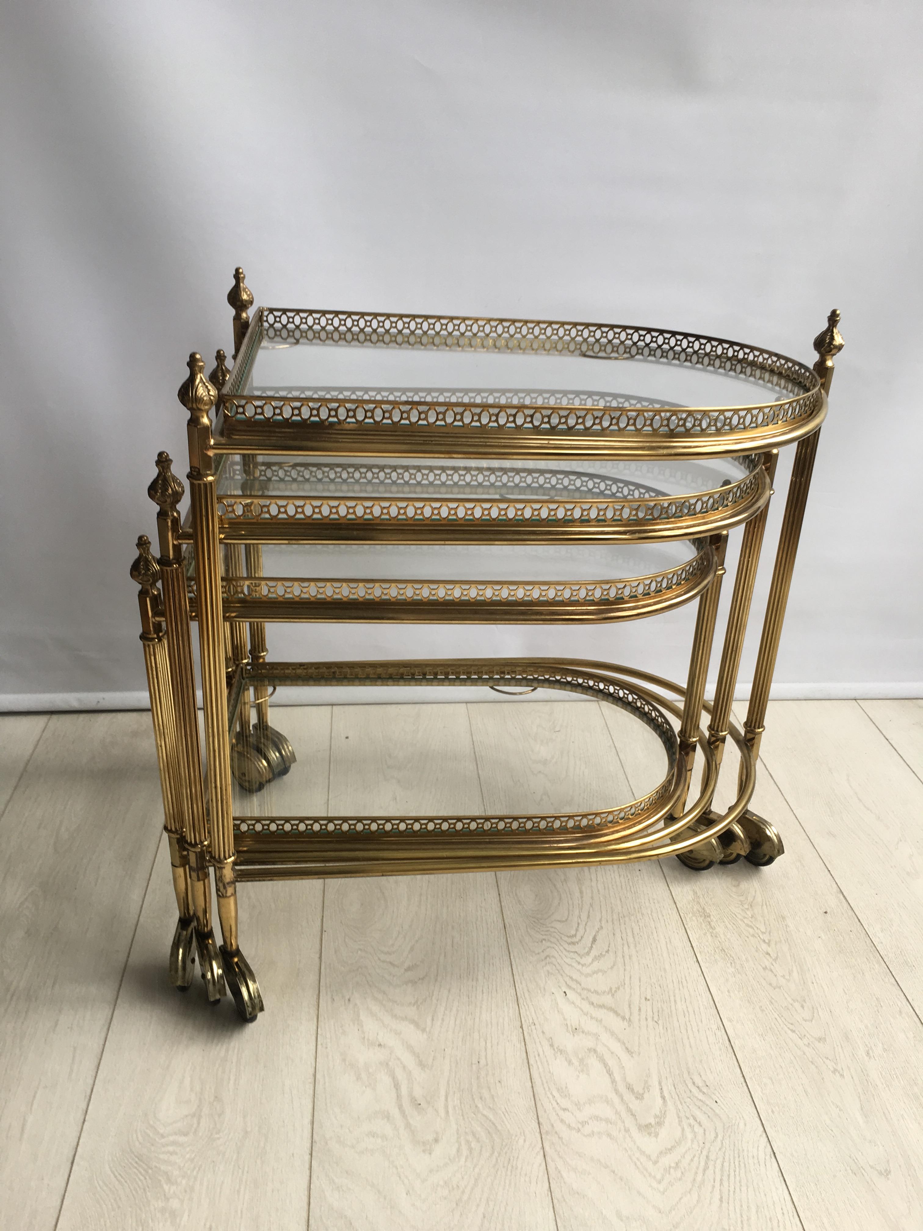 Attributed to Maison Bagués this set of 3 brass nesting tables/bar carts

Lacquered brass frames with a beautiful aged patina

On casters with removable trays,

circa 1950.

Largest table measures 58cm wide, 42cm deep and 62cm tall.