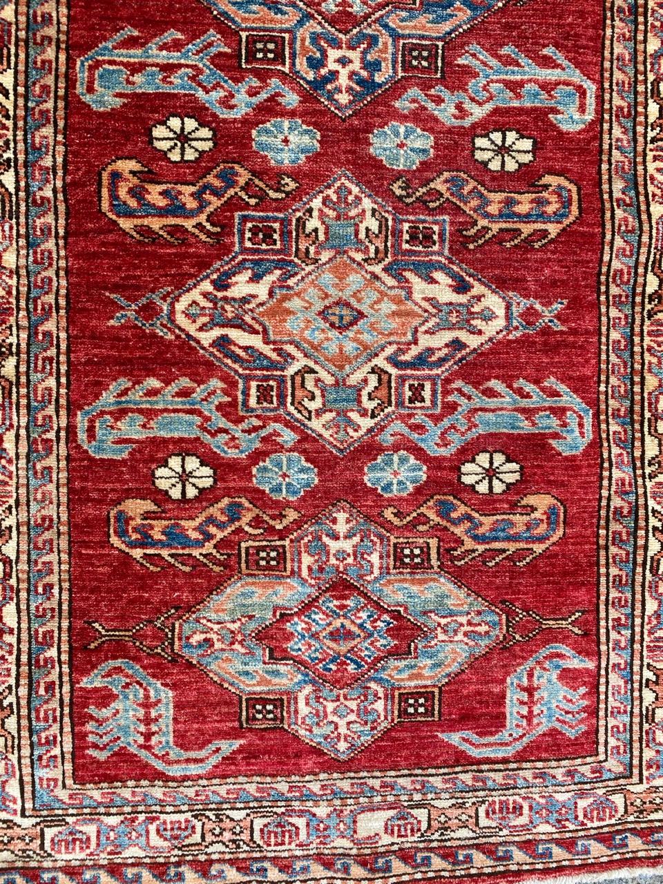 Very nice new Afghan rug with a beautiful Kazak design and nice colors with red, blue and orange, entirely hand knotted with wool velvet on cotton foundation.

✨✨✨
