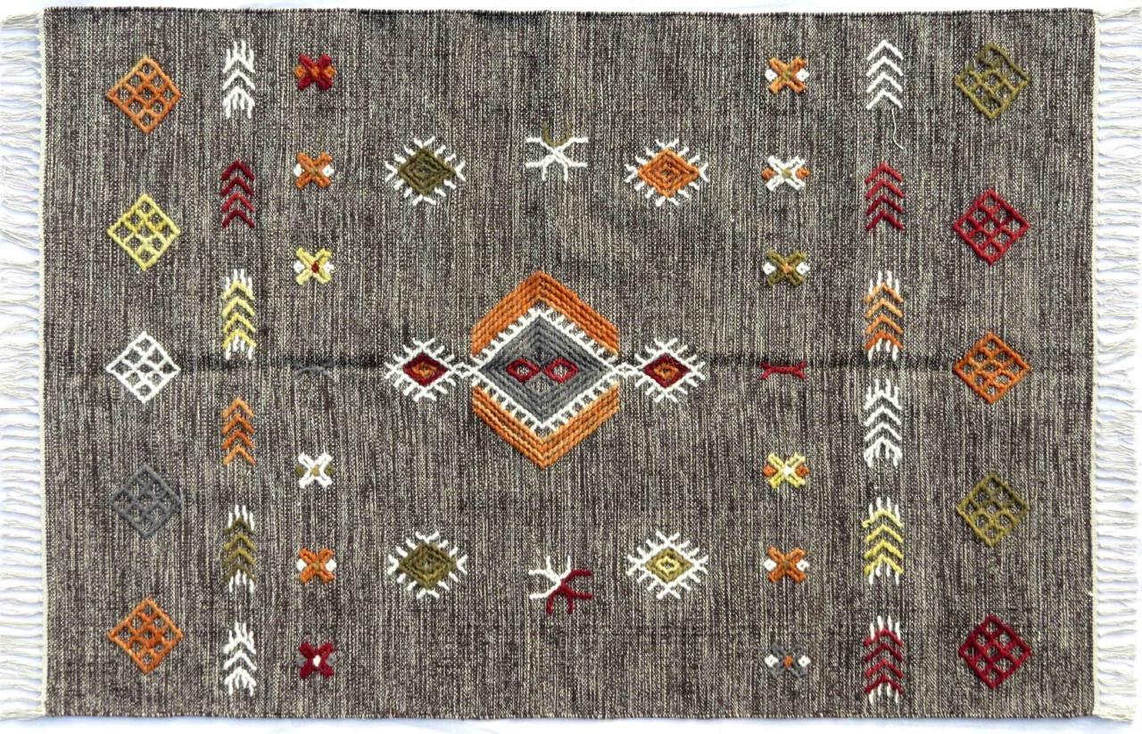 Nice new Kilim with geometrical tribal design and nice colors, entirely handwoven and embroidered with wool on cotton foundation.