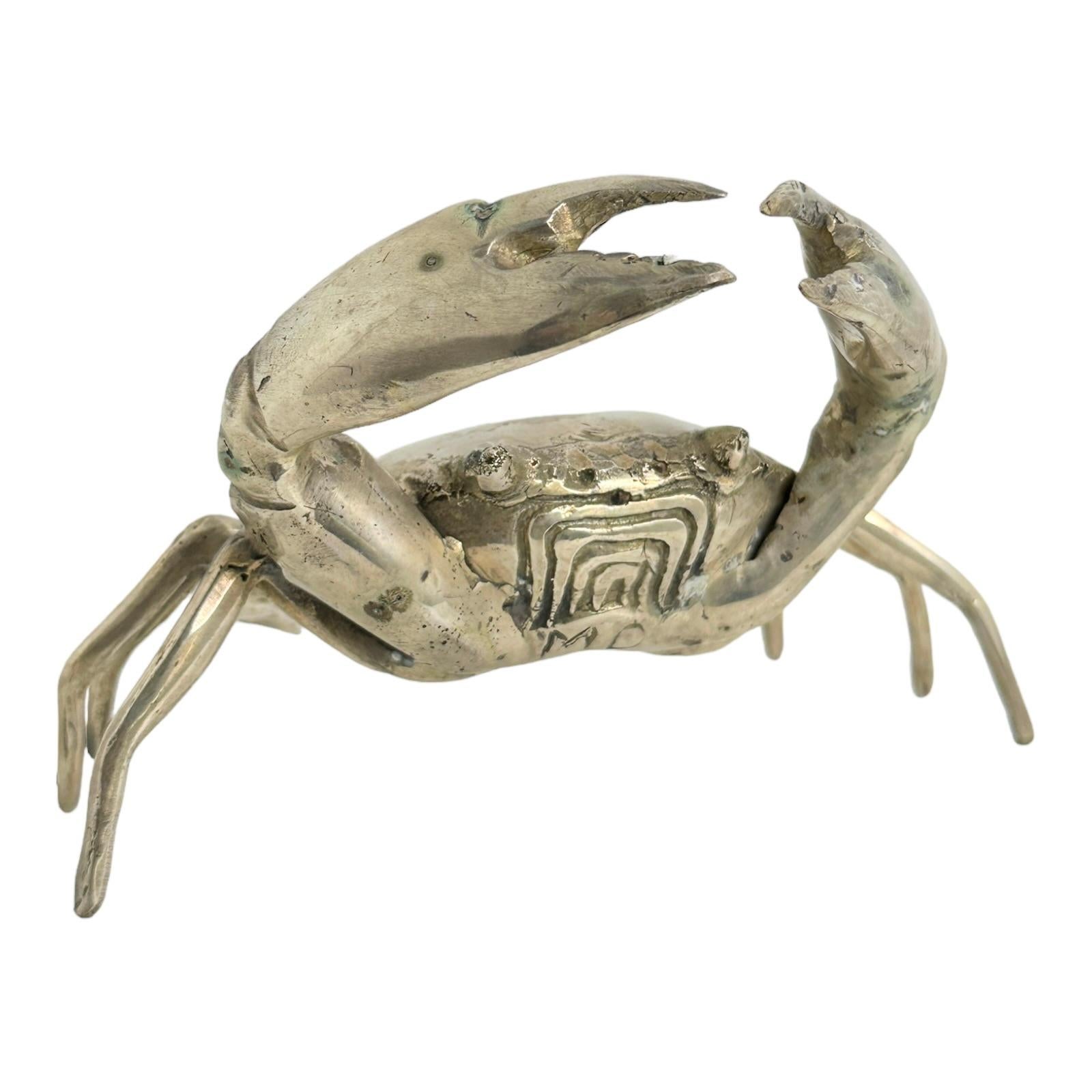This nickel plated metal crab statue was most likely made in the 1980s in Italy. Can not tell the maker or the artist and it is not signed. This particular crab statue is a beautiful piece, it can be displayed as a sculptural focal point on a