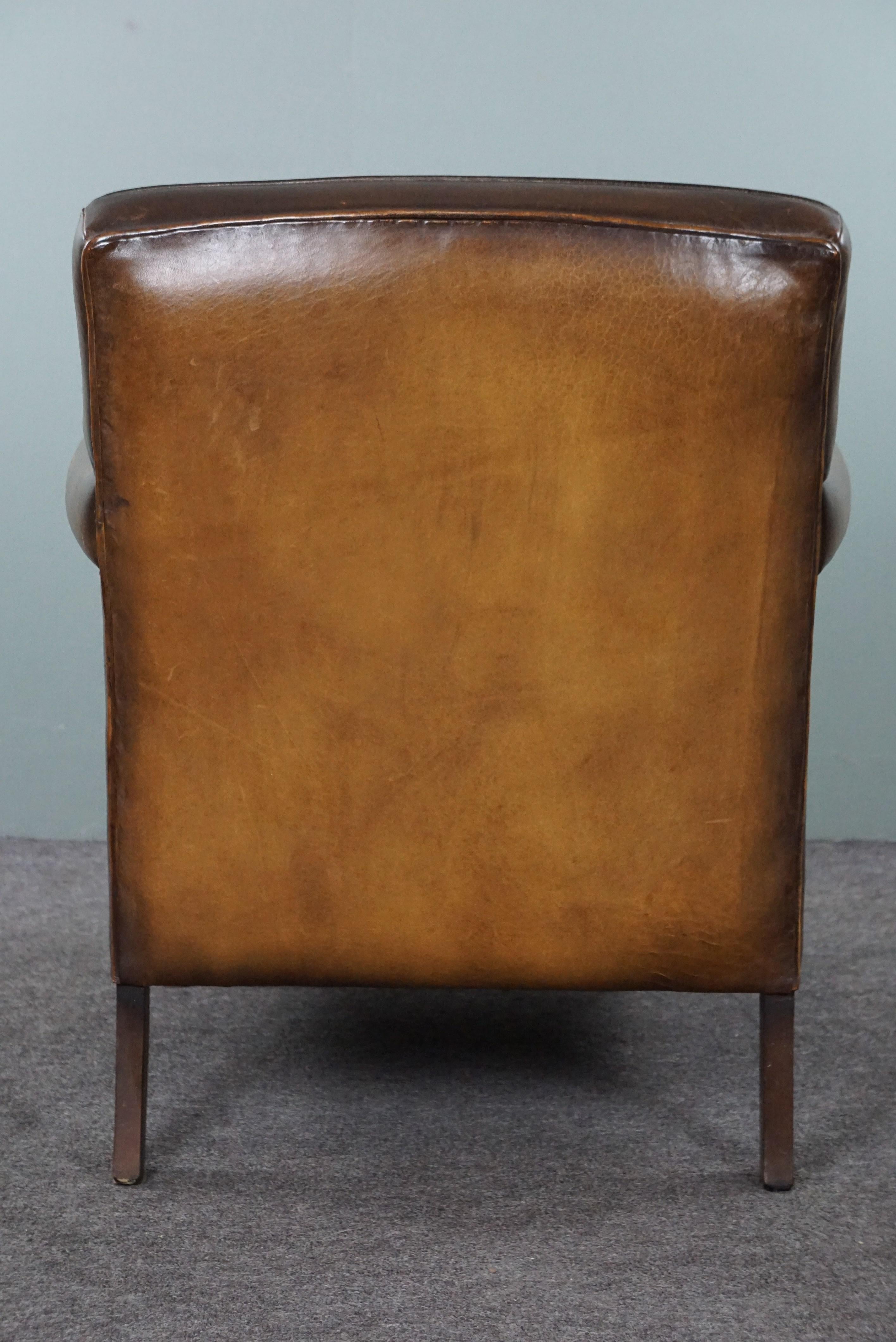Late 20th Century Beautiful old sheep leather armchair with a positively lived-in character For Sale