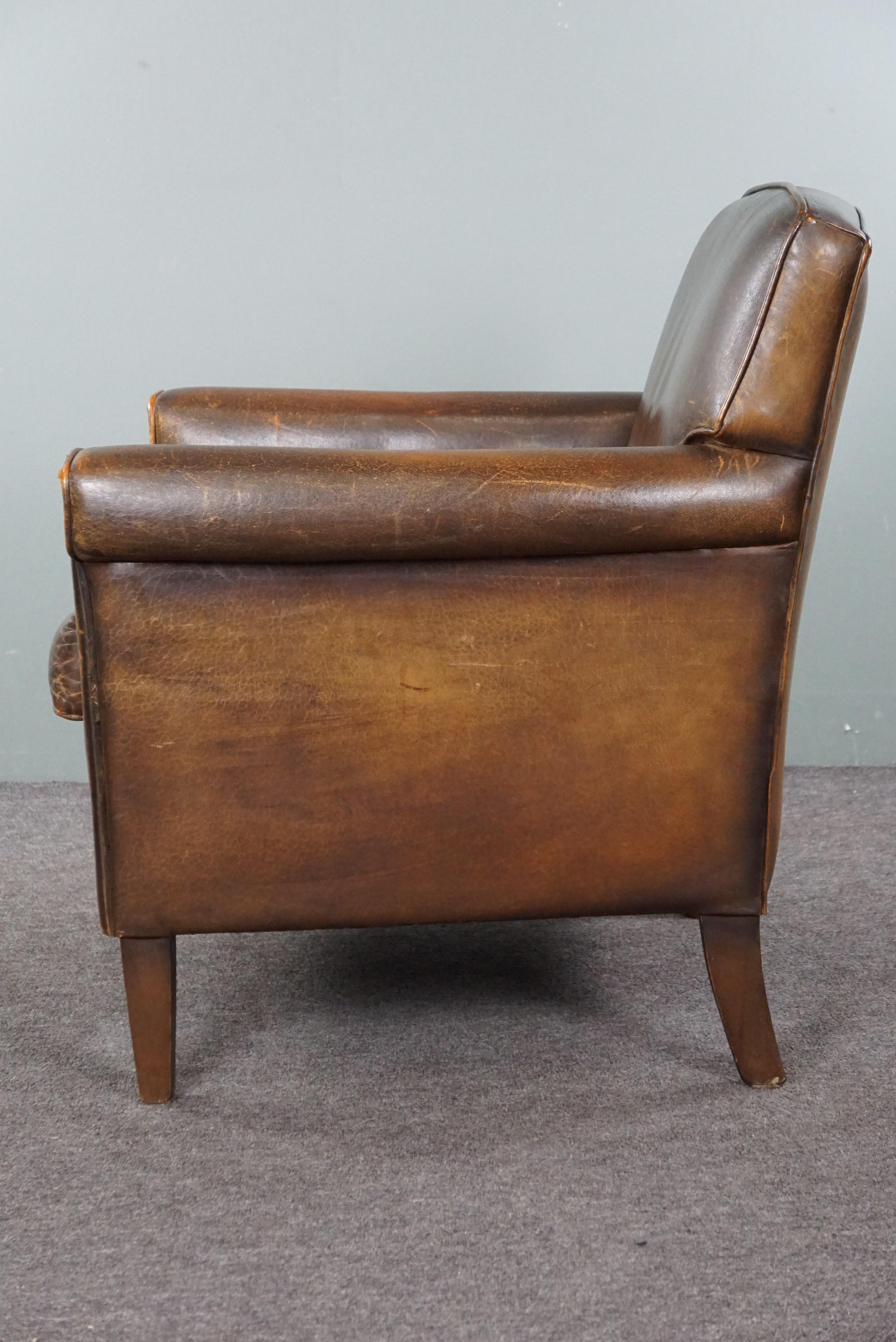 Leather Beautiful old sheep leather armchair with a positively lived-in character For Sale