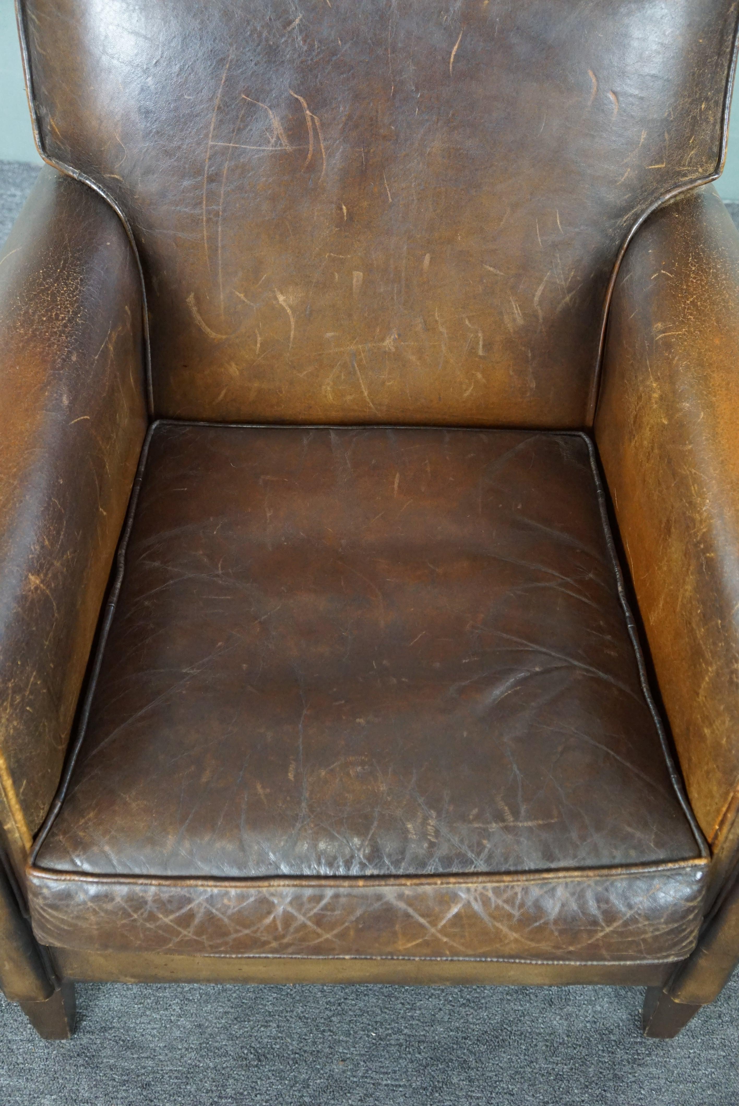 Beautiful old sheep leather armchair with a positively lived-in character For Sale 1