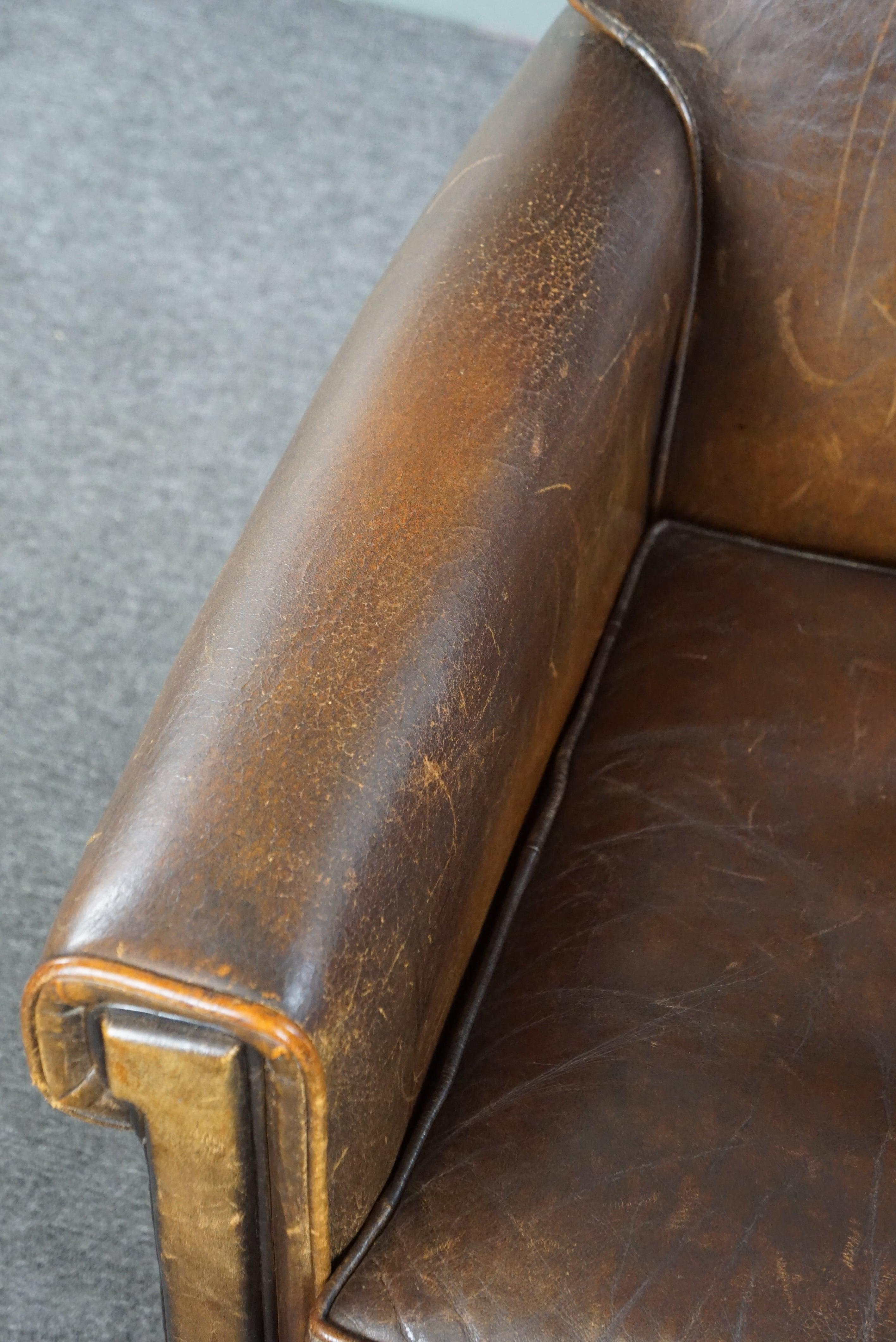 Beautiful old sheep leather armchair with a positively lived-in character For Sale 2