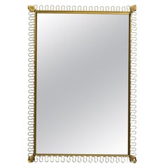Beautiful original 1960s metal wall mirror in a loop design in gold color