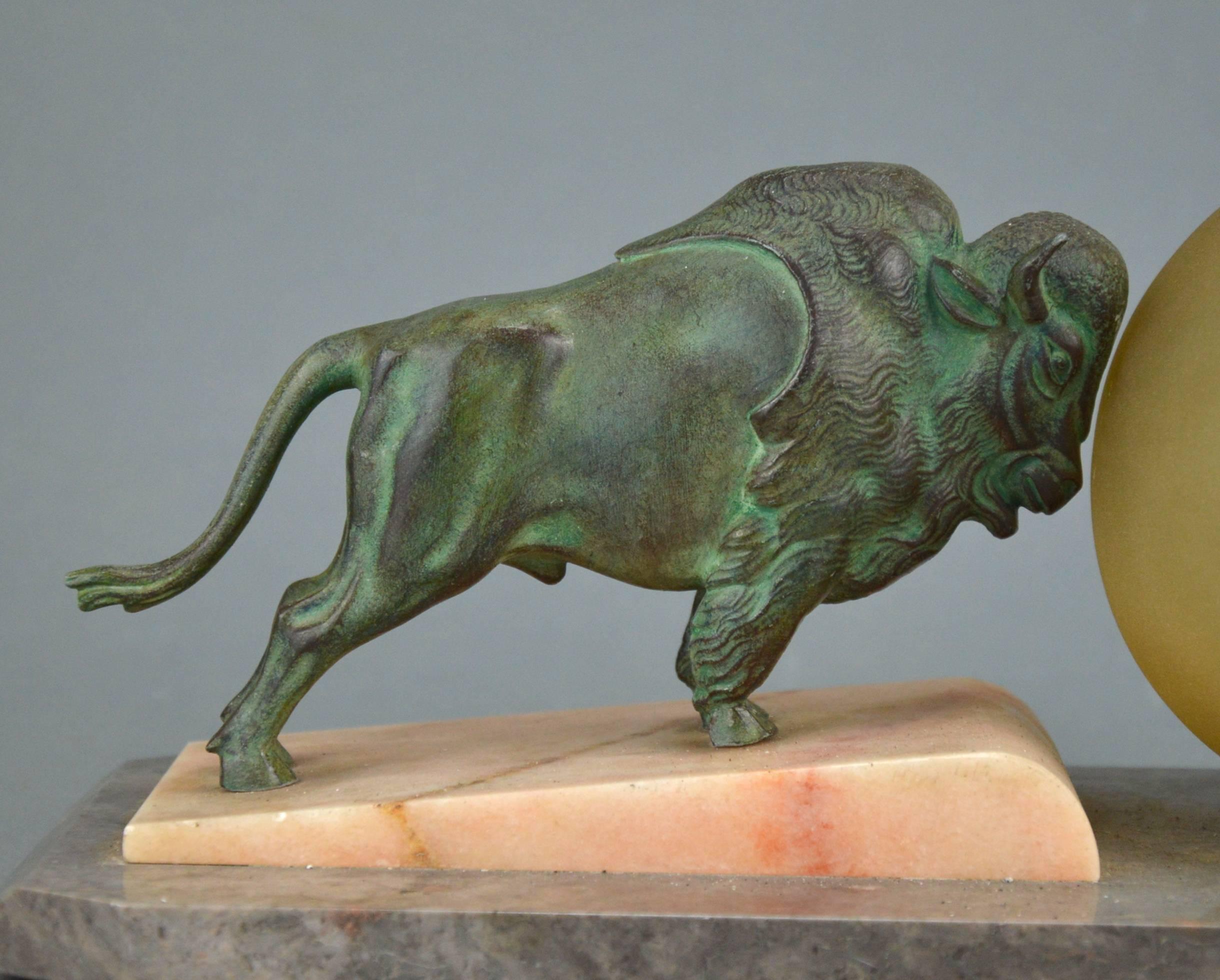 Beautiful original Art Deco table lamp representing a Bison pushing a ball, France, 1920-1930s.
Bison sculpture - patinated metal, base - white marble and grey stone, glass shade.
Dimensions: height - 5 in. (13 cm), base – 10 x 8 x 9 in. (12 x 5.5
