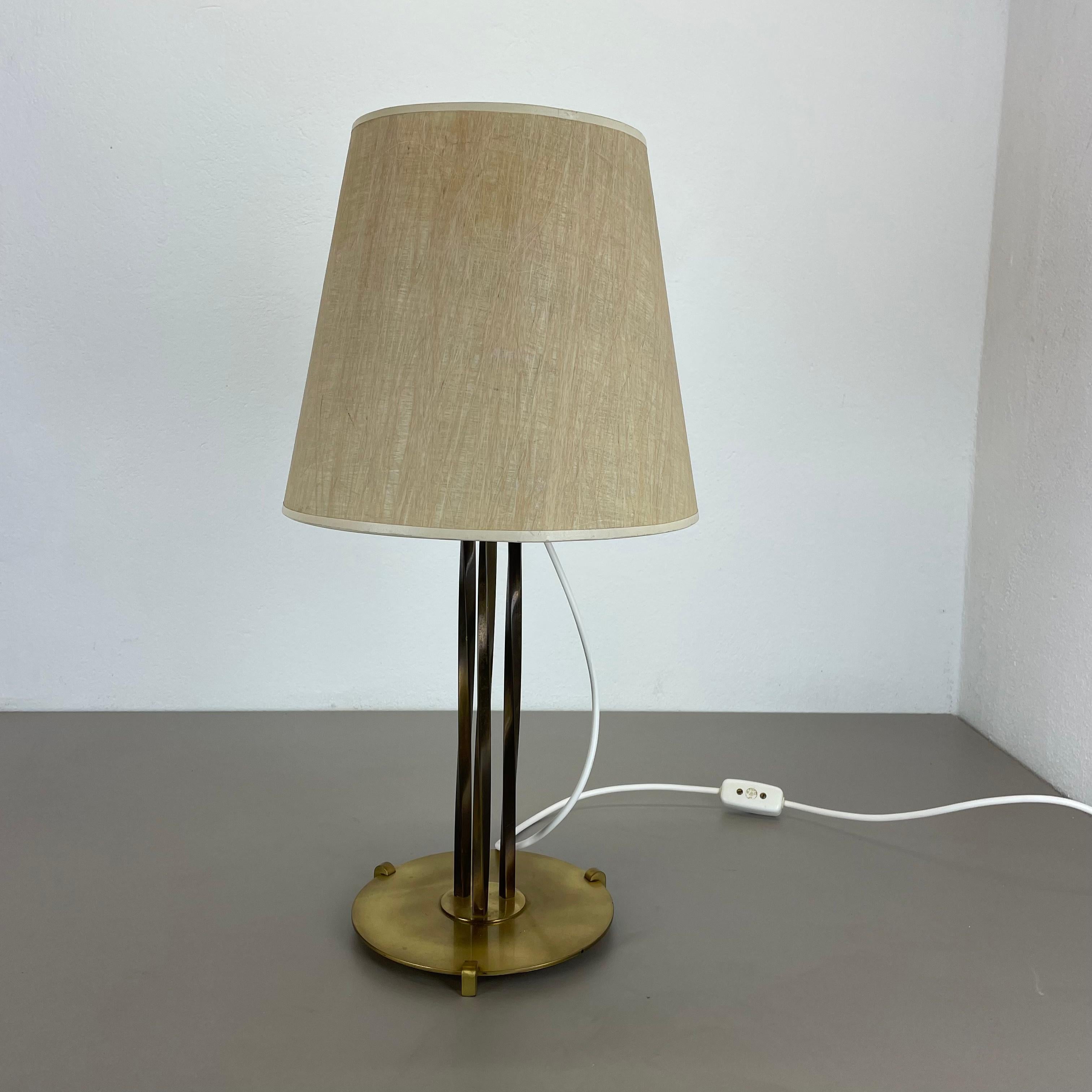 Article:

table light


Origin:

Austria


Age:

1960s


This original vintage table light was designed and produced in the 1960s in Austria. the super rare and minimalist stand element is made of brass combined with 3 upright