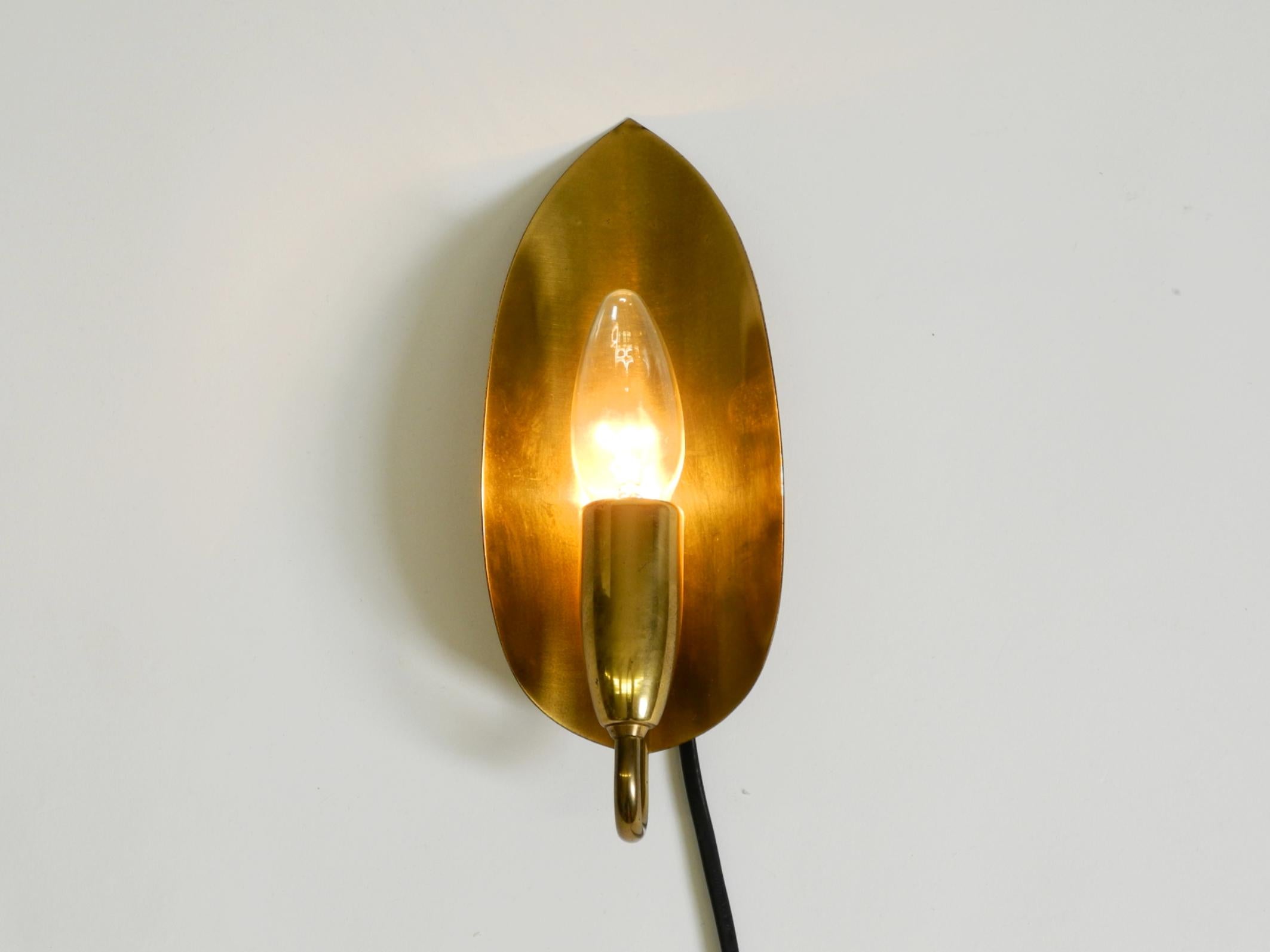 German Beautiful original Mid Century Modern cone wall lamp made of brass For Sale