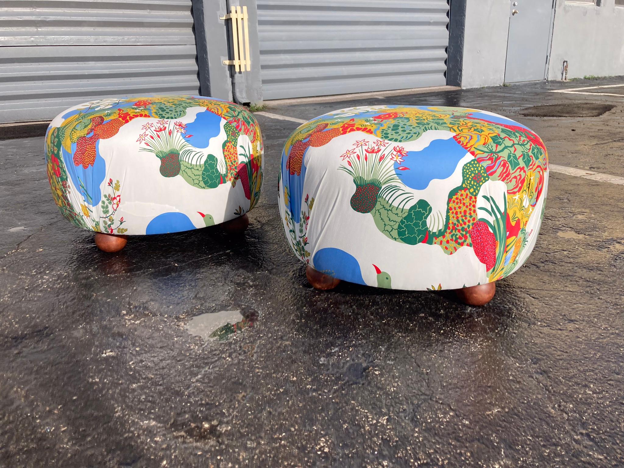 Pair of beautiful Ottomans covered in Josef Frank Anakreon Fabric by Svenskt Tenn. Each ottoman has four apple shaped wood feet with mahogany stain finish. Ready for a new home.