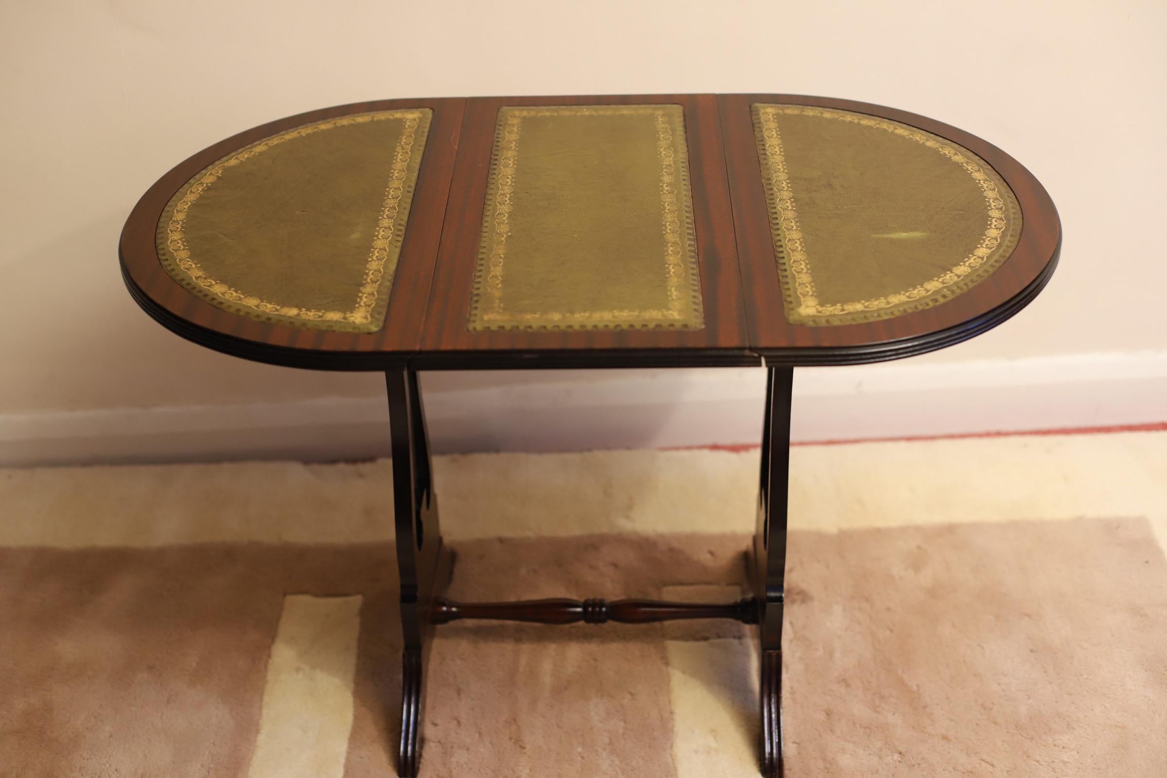 Beautiful Oval Folding Caffe Table With Leather Top and swivel action top , this table is in perfect condition for the age it has been clean and polished .


Don't hesitate to contact me if you have any questions.


Please have a closer look