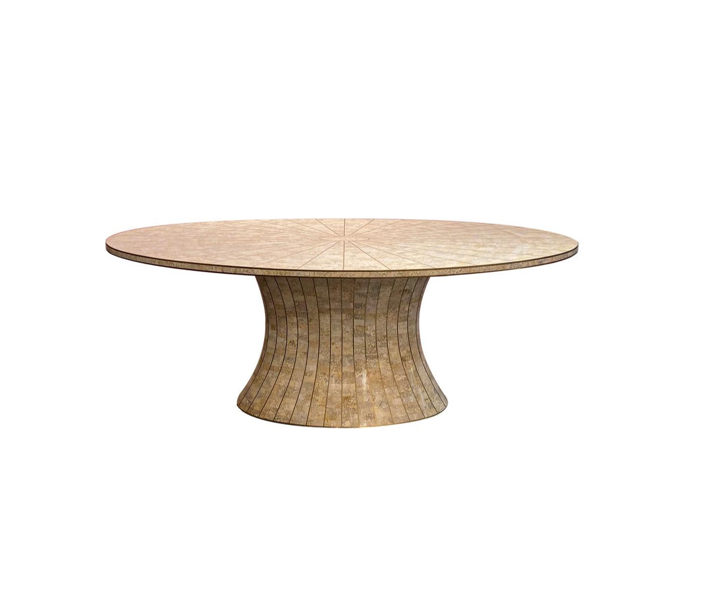 A true masterpiece of craftsmanship, Beautiful oval tessellated stone dining table and brass inlay by Maitland Smith philippines.

The brass inlay draws the eye to both the tabletop and the tapered base, making it a veritable architectural and