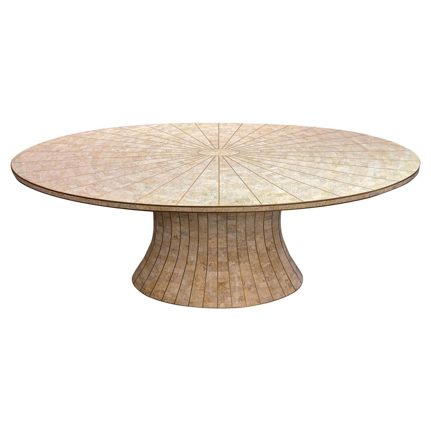 Beautiful oval tessellated stone dining table and brass by Maitland Smith. 