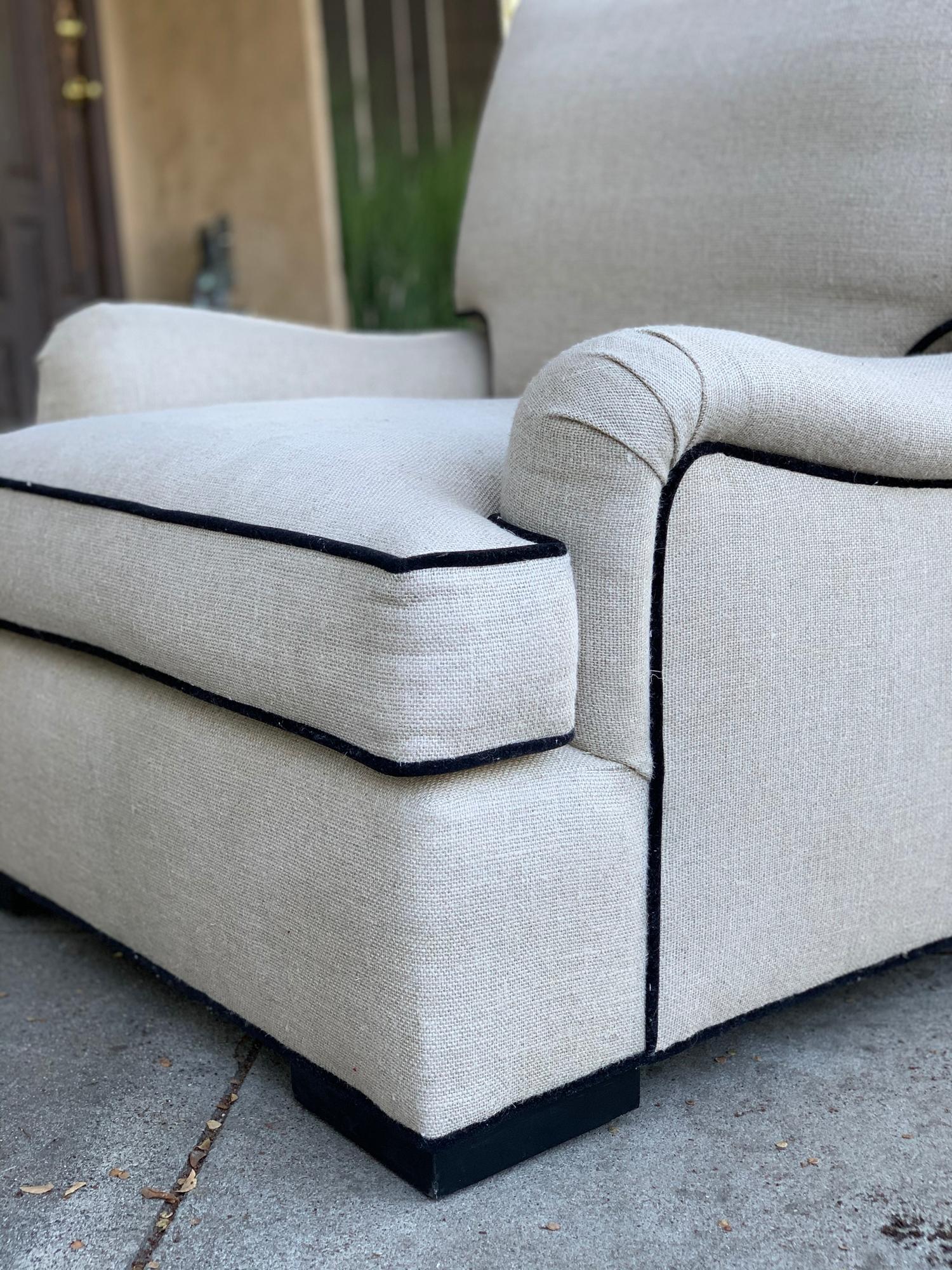 Beautiful oversize armchair upholstered in a cream color cotton mix fabric and black piping.
The chair is newly upholstered, the cushion is filled with down filling.
Measurements:
28.5” high floor to top of backrest x 33” high (floor to top of