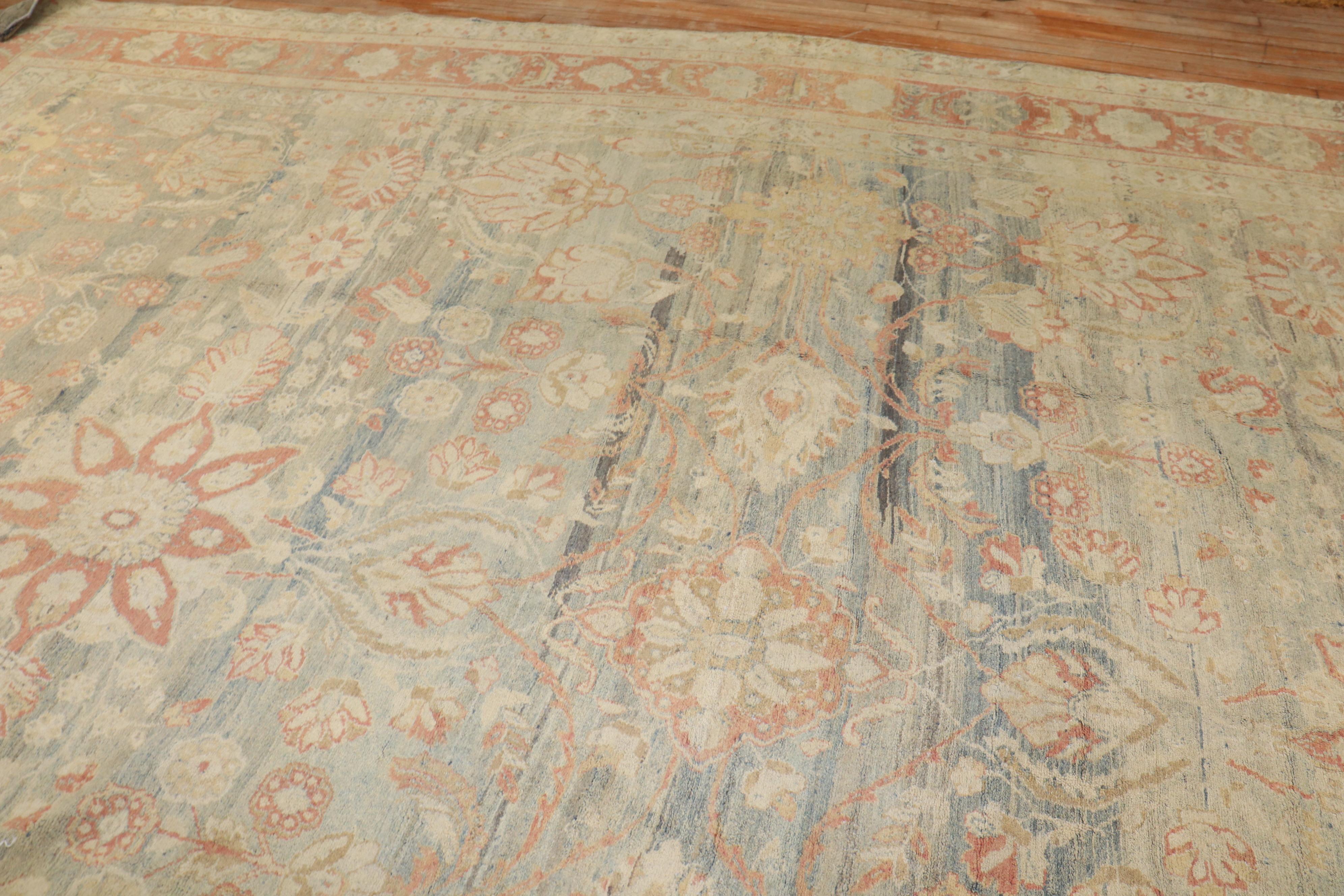 An early 20th century Persian Bibikabad oversize rug with an elegant allover design in muted colors

Measures: 12' x 16'6