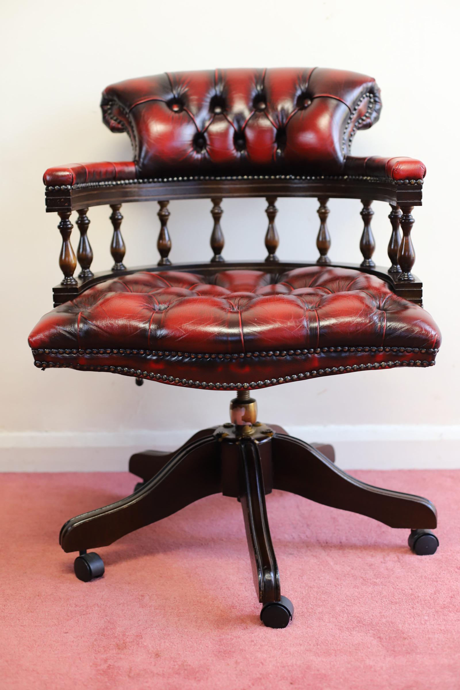 We delight to offer for sale this fantastic ox blood red captain deep buttoned swivel desk chair. This chair is in great condition with no tares, rips or buttons missing. The rise and fall action works well and it has a tilting action as well which