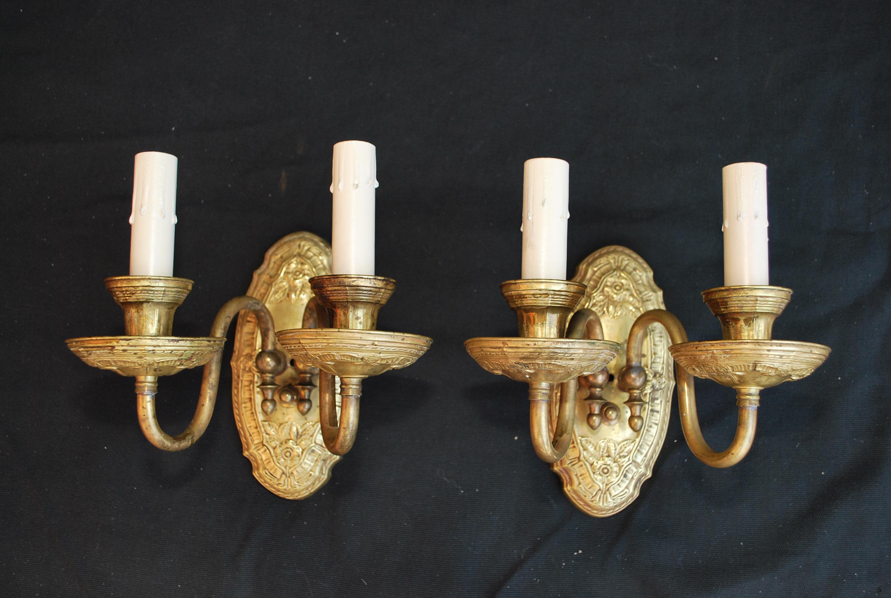 A beautiful pair of 1920s Brass sconces the patina is much nicer in person, the details are amazing.