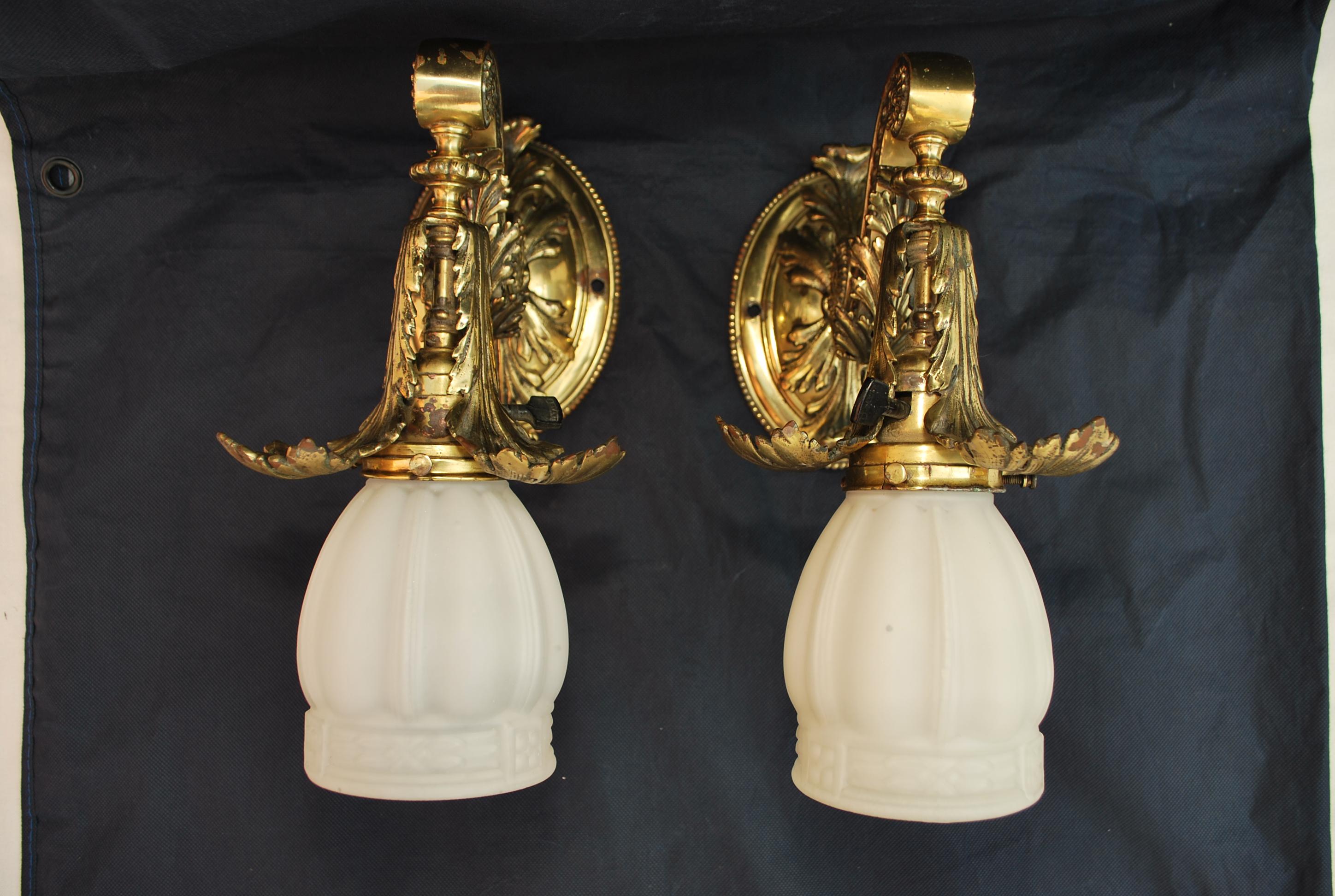 A beautiful and elegant pair of 1920's brass sconces, they are quite heavy, the quality is there, the patina is so nicer in person