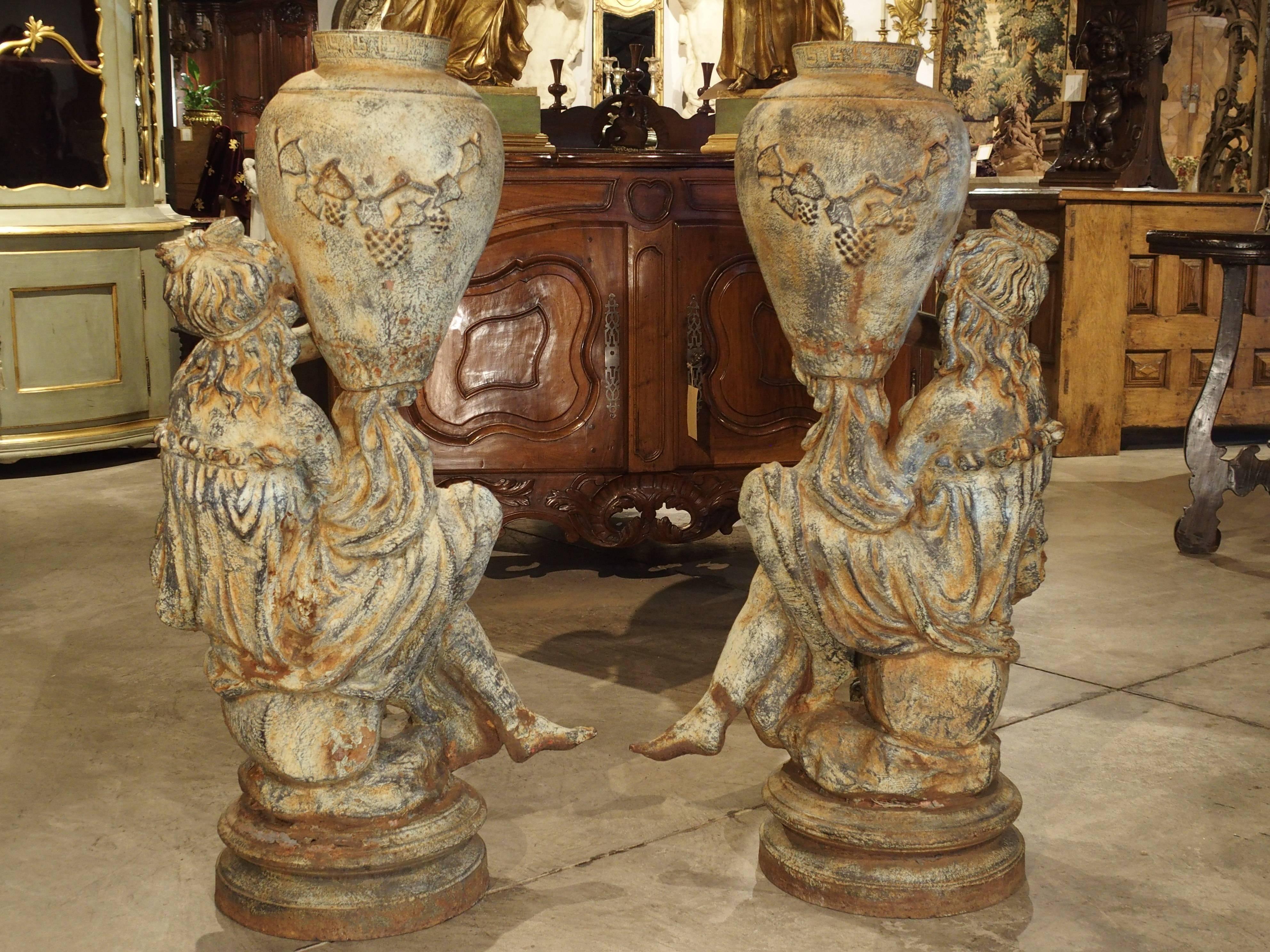 Beautiful Pair of Antique Cast Iron Figural Garden Urns In Good Condition In Dallas, TX