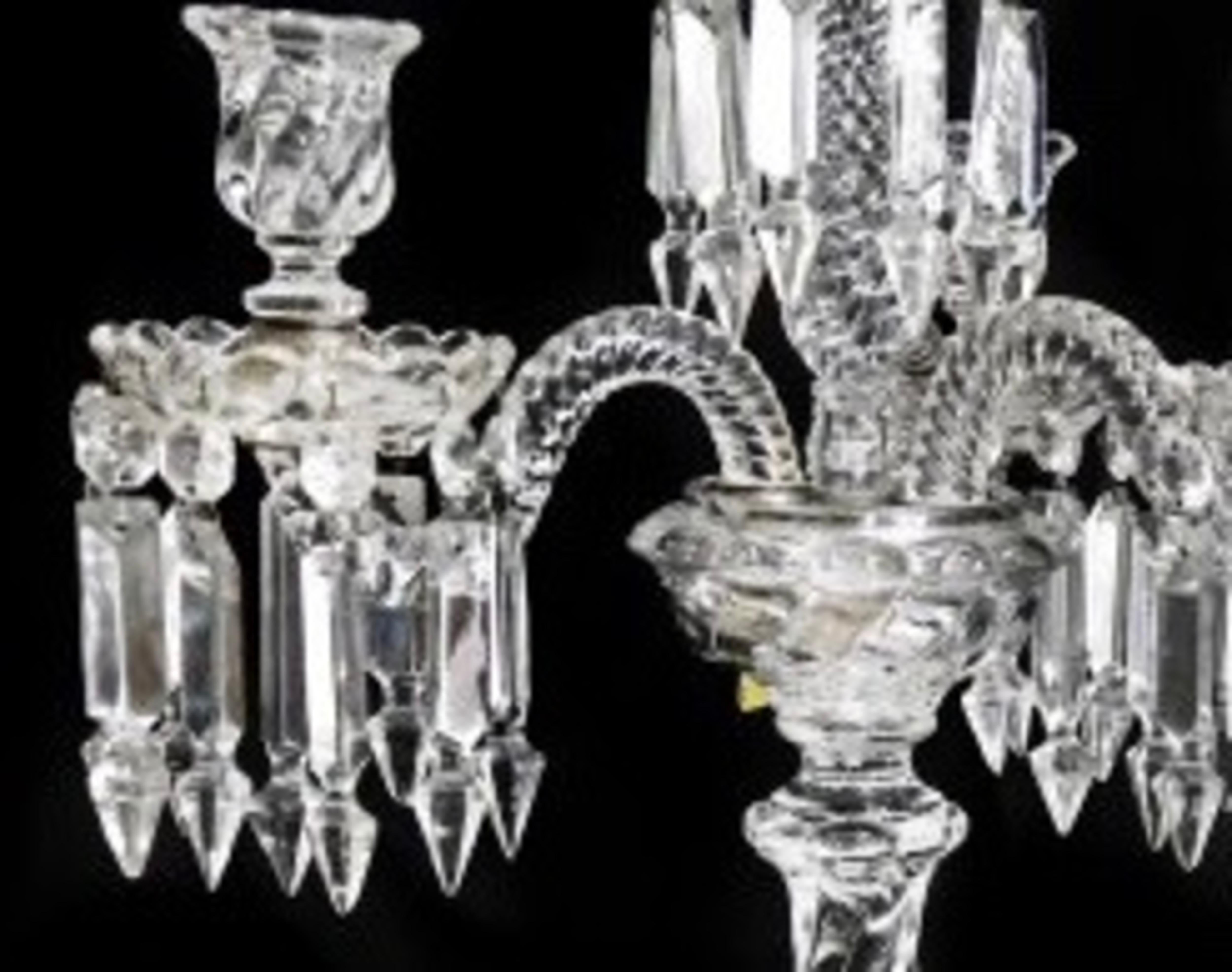 A pair of Baccarat molded and cut glass four-light candelabra, each with molded Baccarat mark. 
Measures: Height 20 1/2 in.