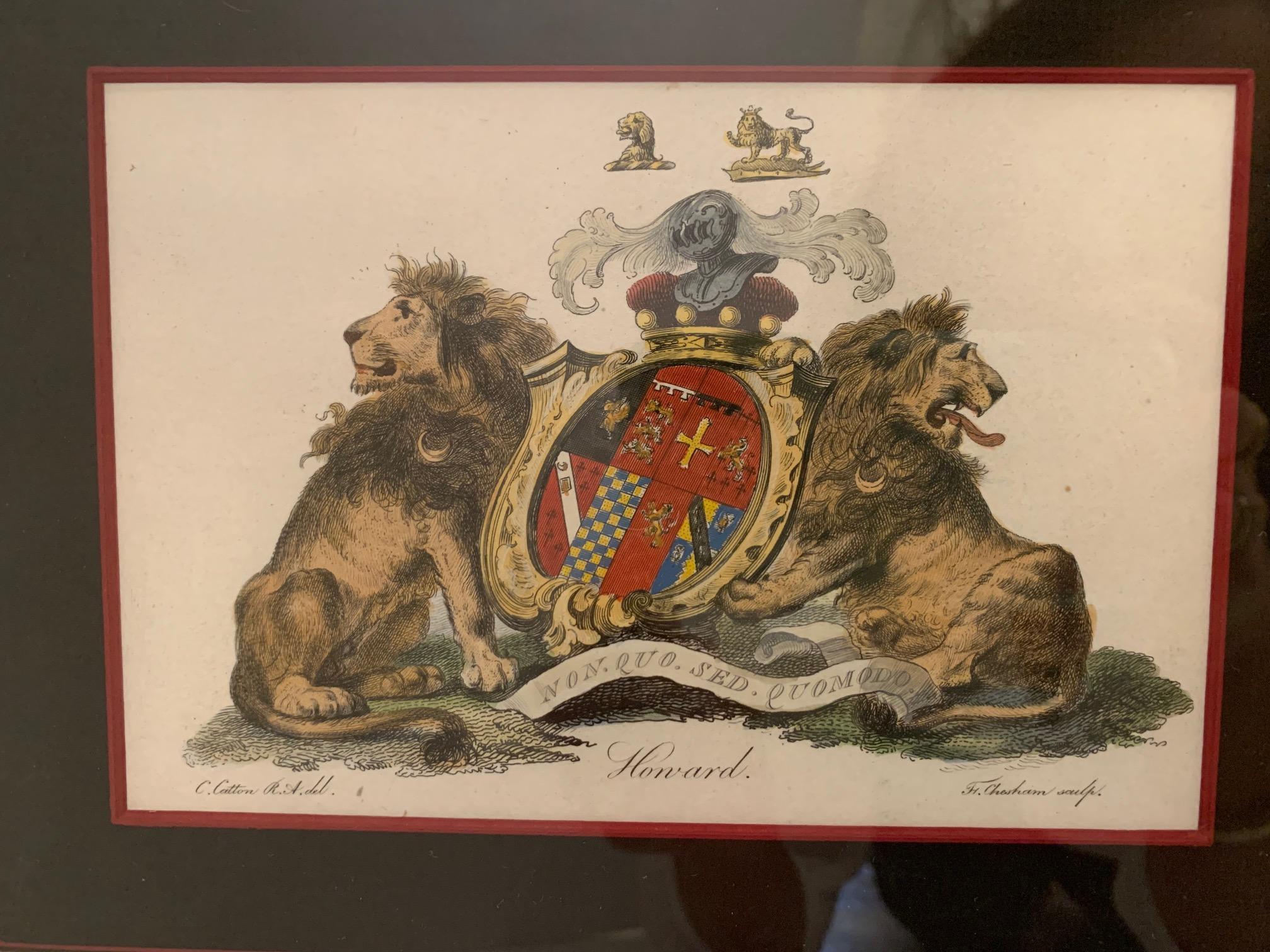 Beautifully framed pair of colored etchings having a regal feel with royal shields flanked by lions, elk and such.