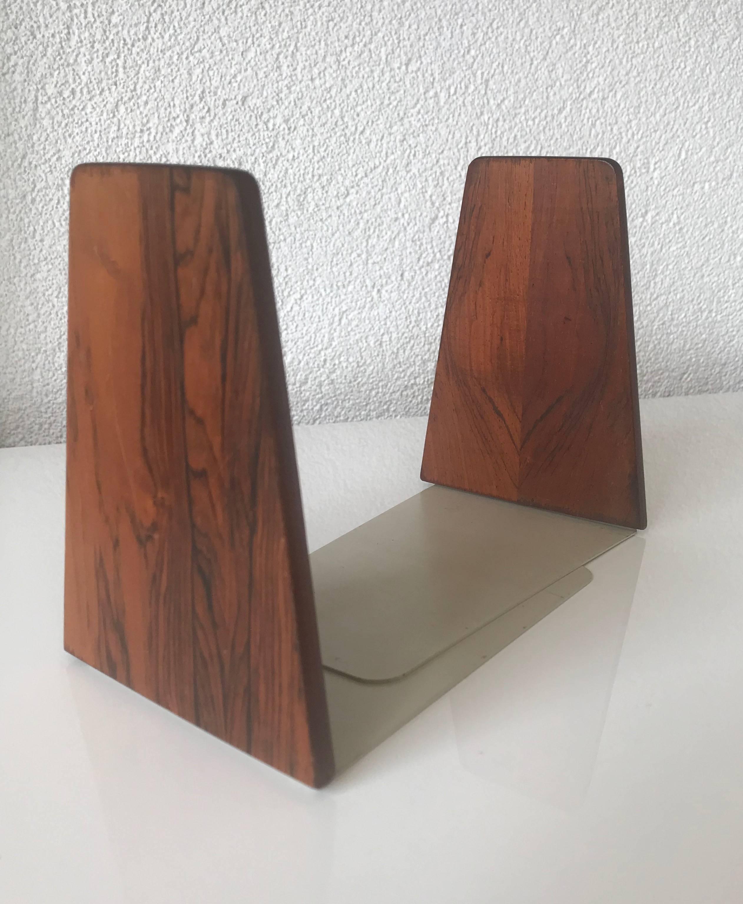 Practical and stylish midcentury bookends.

If you are a collector of mid-century furniture and home accessories then these beautiful shape and condition bookends could be the perfect addition to your interior. The combination of the fine wood and