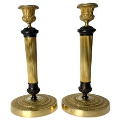 Antique Beautiful pair of Empire Candlesticks in gilt and dark patinated bronze. 1820s