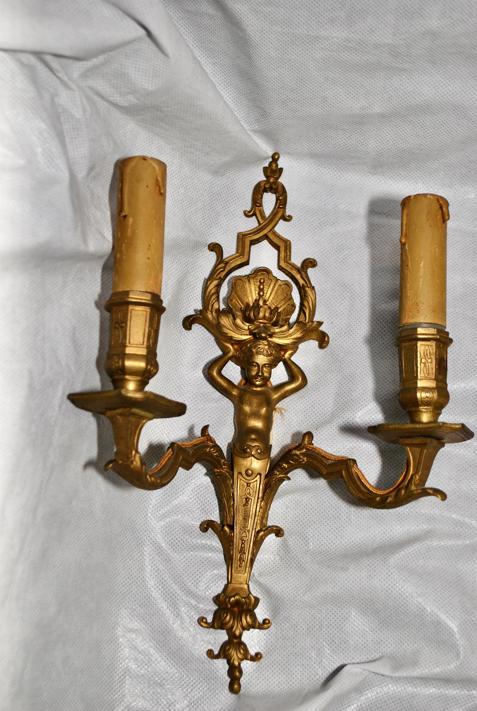 Beautiful Pair of   French bronze Cherubs  sconces In Good Condition For Sale In Los Angeles, CA