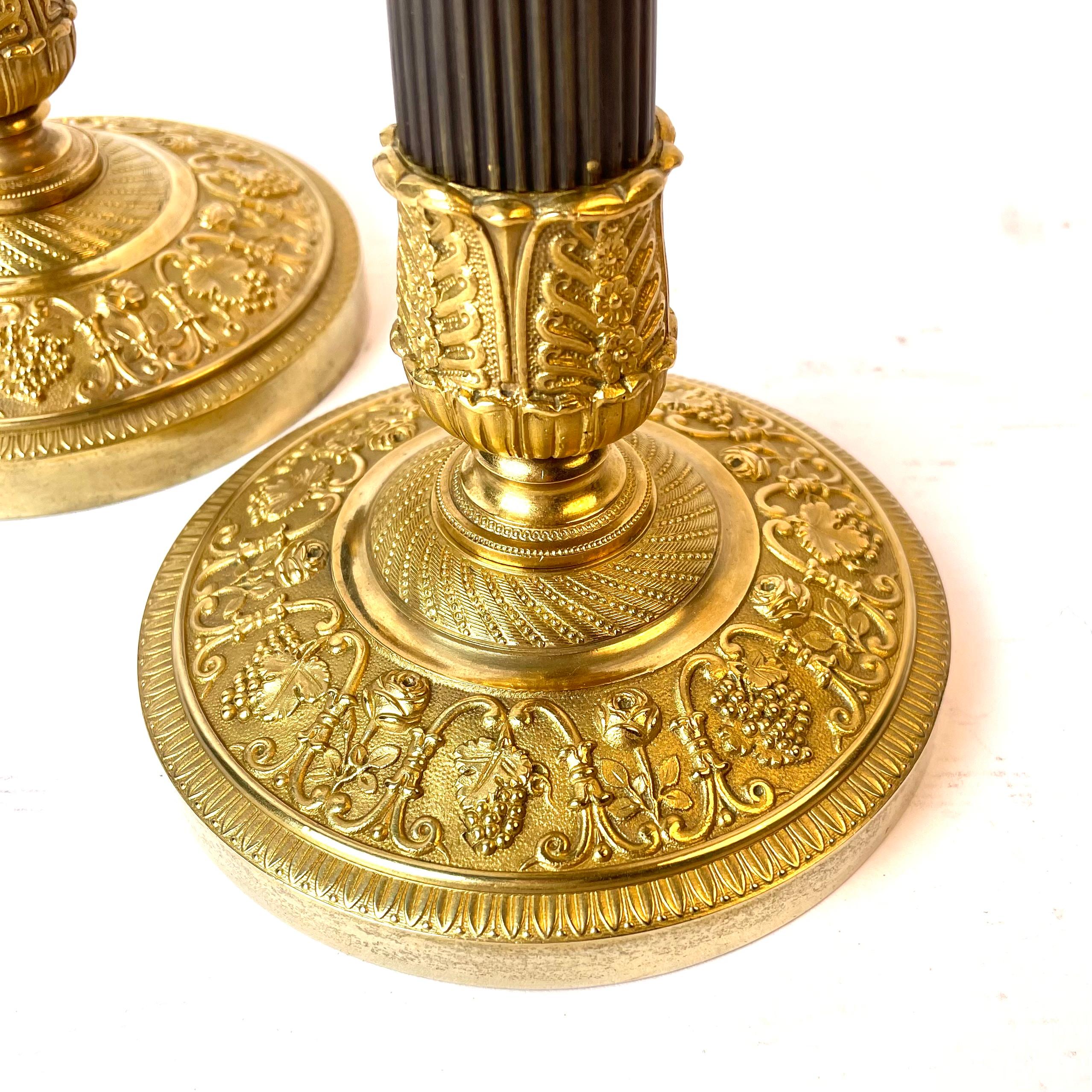 Gold Plate Beautiful Pair of French Empire Gilt and Dark Patinated Bronze Candlesticks For Sale
