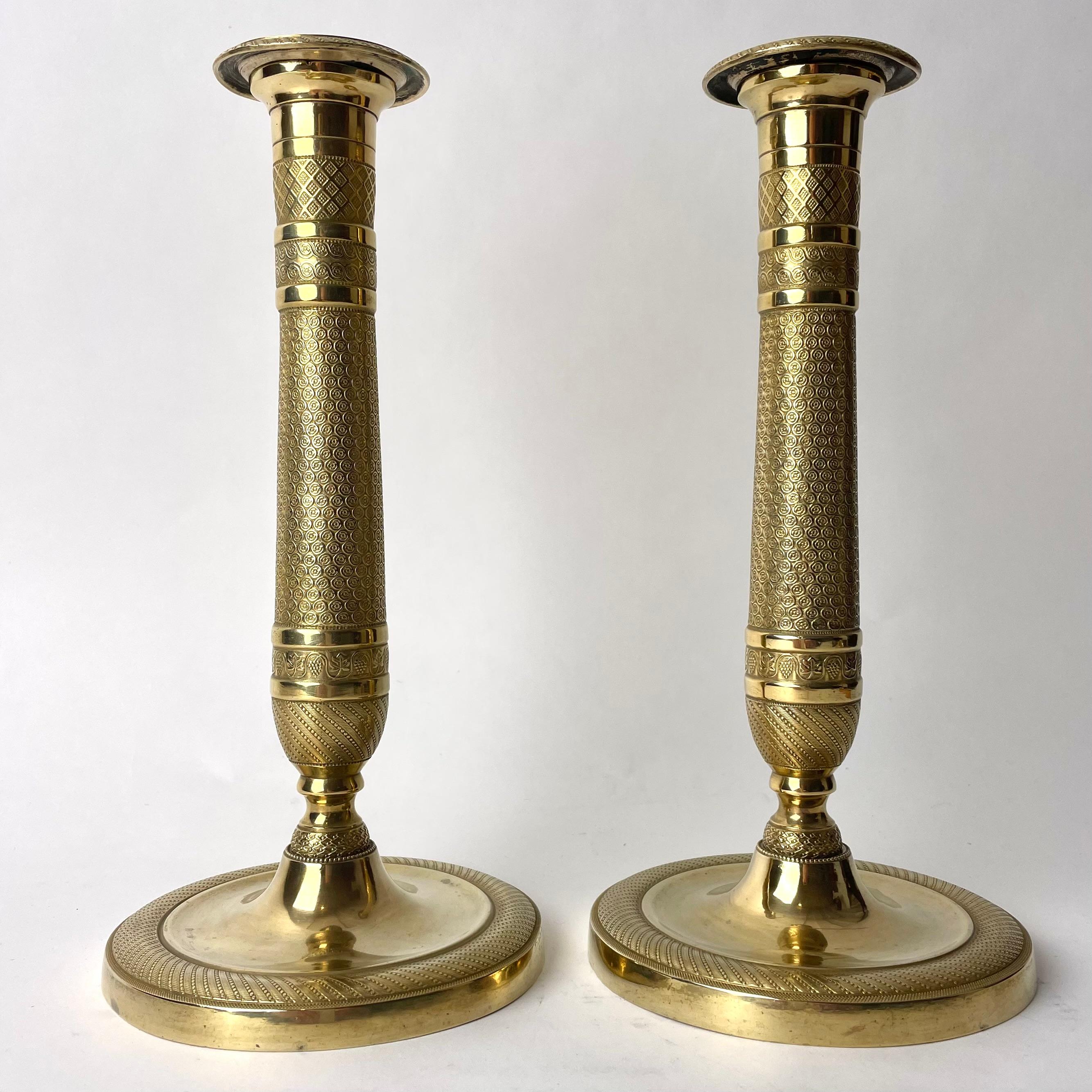 A beautiful pair of gilt Empire Candlesticks from France. made during the 1820s. Good gilt and with period Empire decor of flowers, grapes and check pattern.


Wear consistent with age and use 