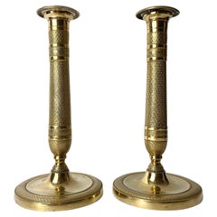 Magnifique paire de chandeliers Empire dorés des années 1820