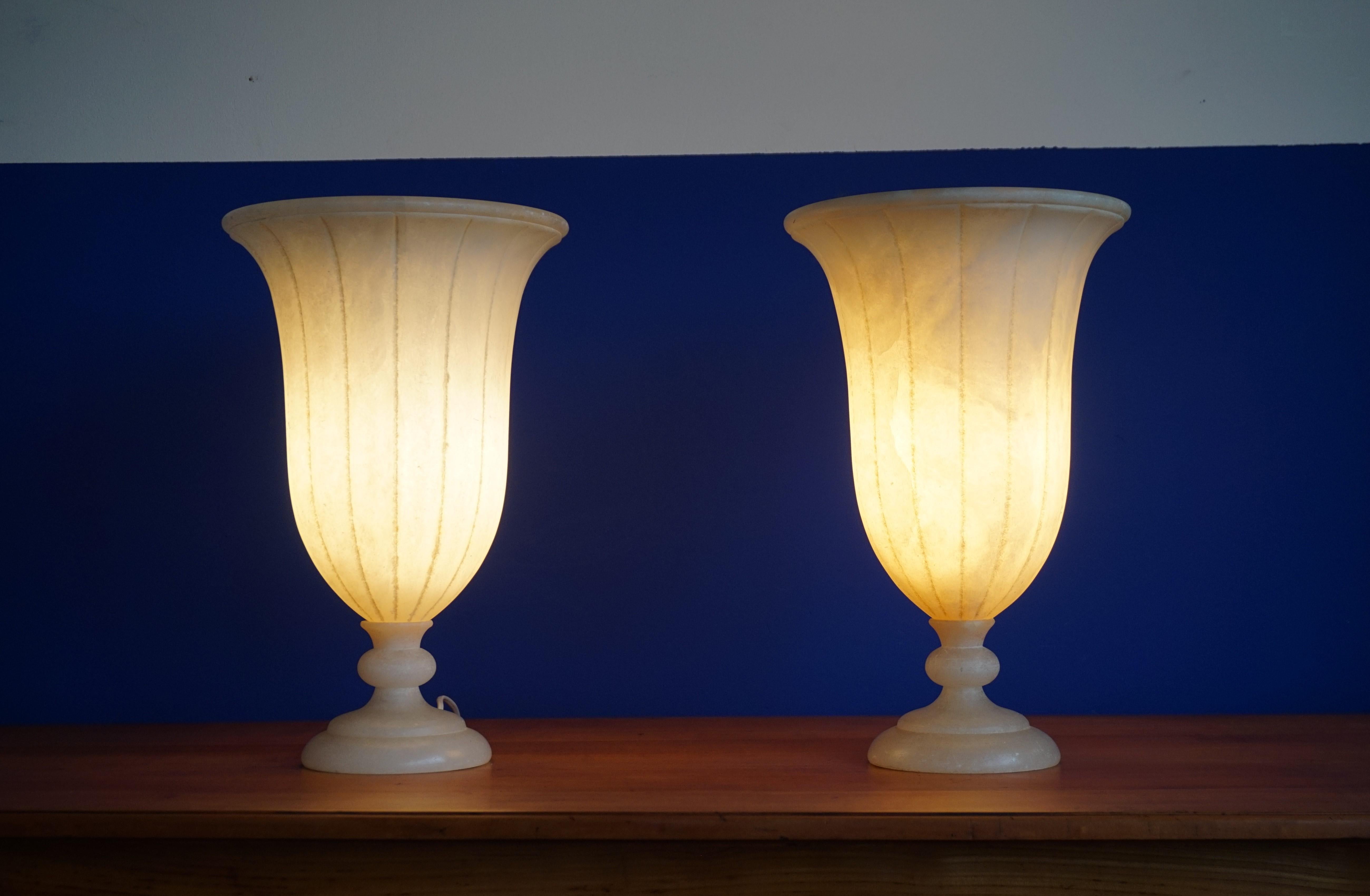 Good size and beautiful atmosphere creating table lights.

This rare pair of handcrafted, mineral stone table lamps is another one of our recent great finds. With their size and timeless design these alabaster lamps are an absolute joy to own and