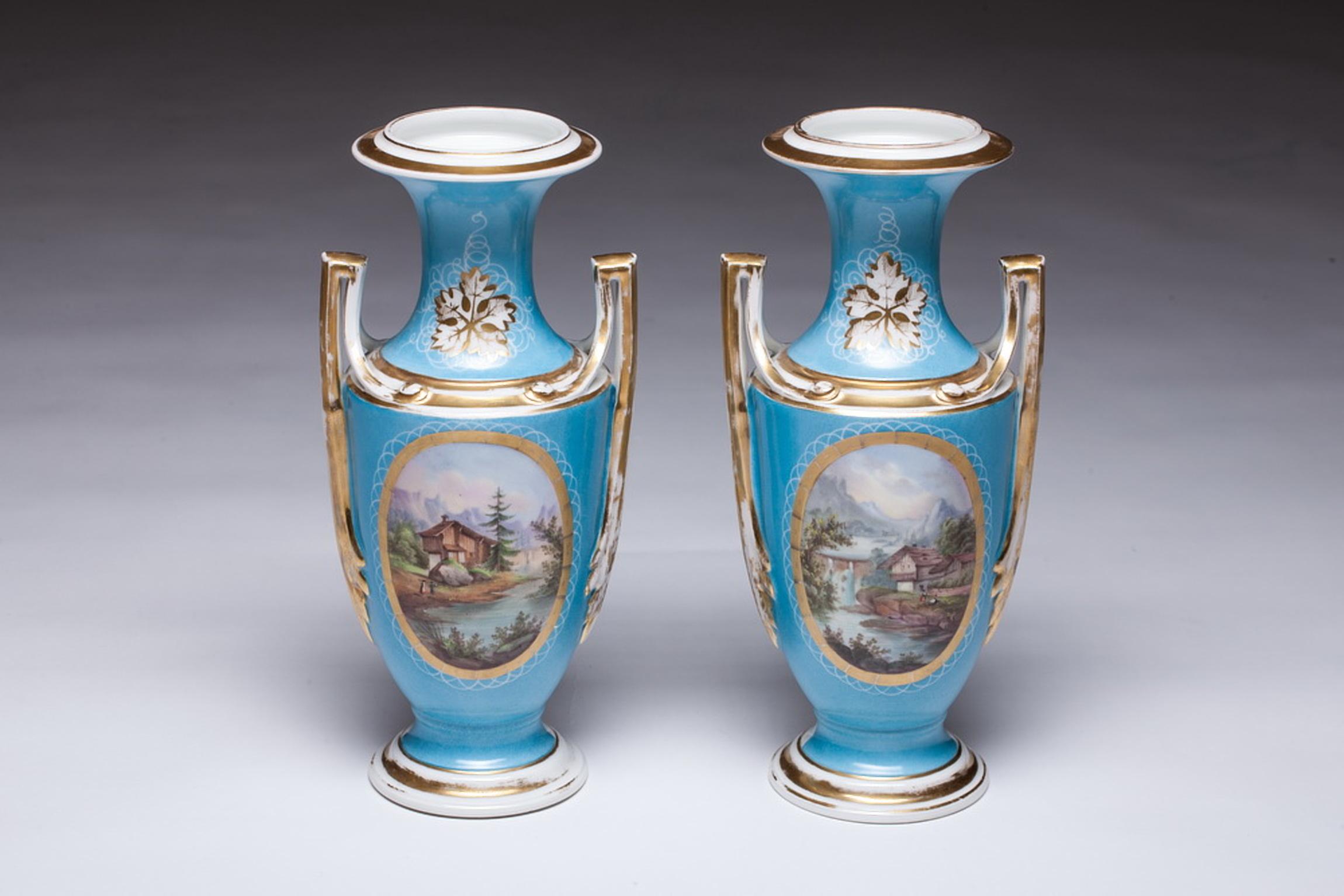 Beautiful pair of hand painted Old Paris porcelain vases. Blue color porcelain vases painted landscape. Vases are with two handles.

 