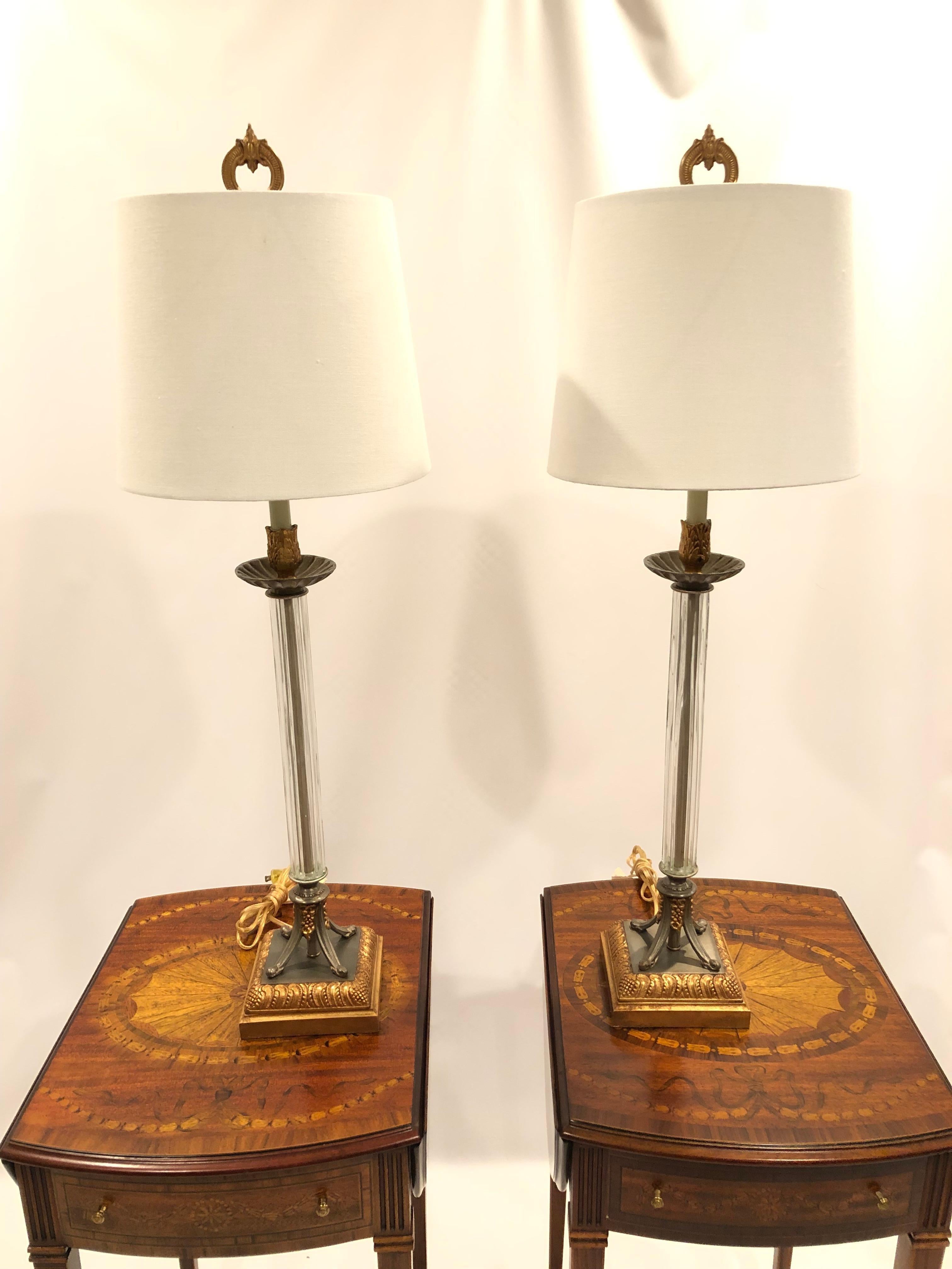 Beautiful pair of gilt metal and crystal column shaped lamps where the blend of gold and greyish celadon metal make an elegant statement.
Bases are 5.5 square.